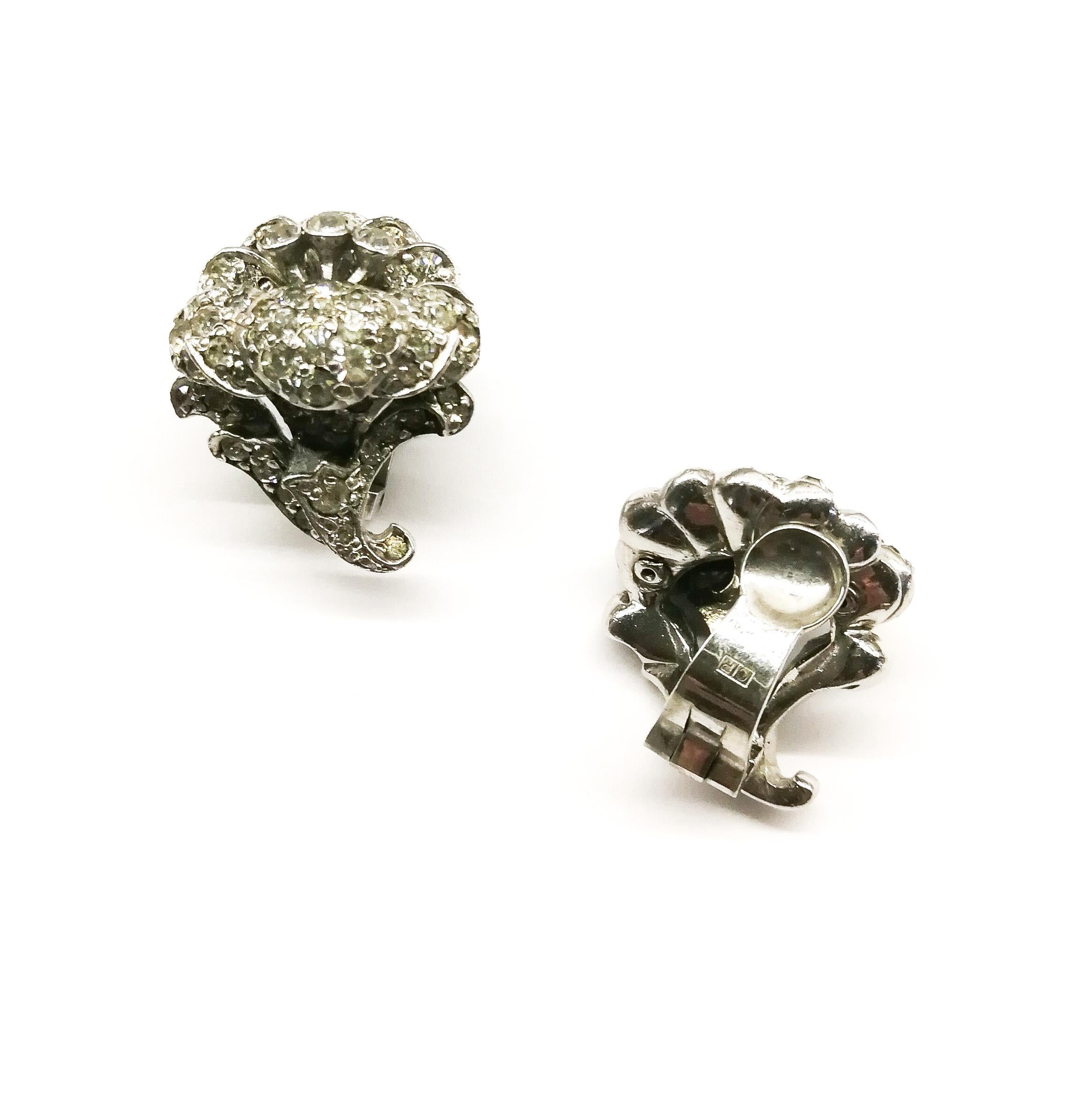 A classic pair of clear paste earrings, with overtones of Georgian and Victorian real jewellery, these smart floral style earrings by Ciro Of London are easily wearable and adaptable to many occasions.
CIRO was established in 1917 and continues its