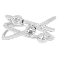 Elegante anello di diamanti tondi e brillanti da 0,20 carati con 3 pietre in platino