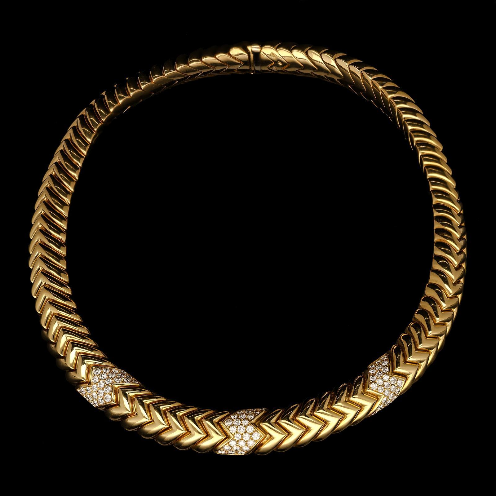 A stylish vintage gold and diamond Spiga necklace by Bulgari c.1970s, formed of closely set interlocking uniform links of zig-zag design, the front set with three evenly spaced diamond sections, each set with twenty seven round brilliant cut