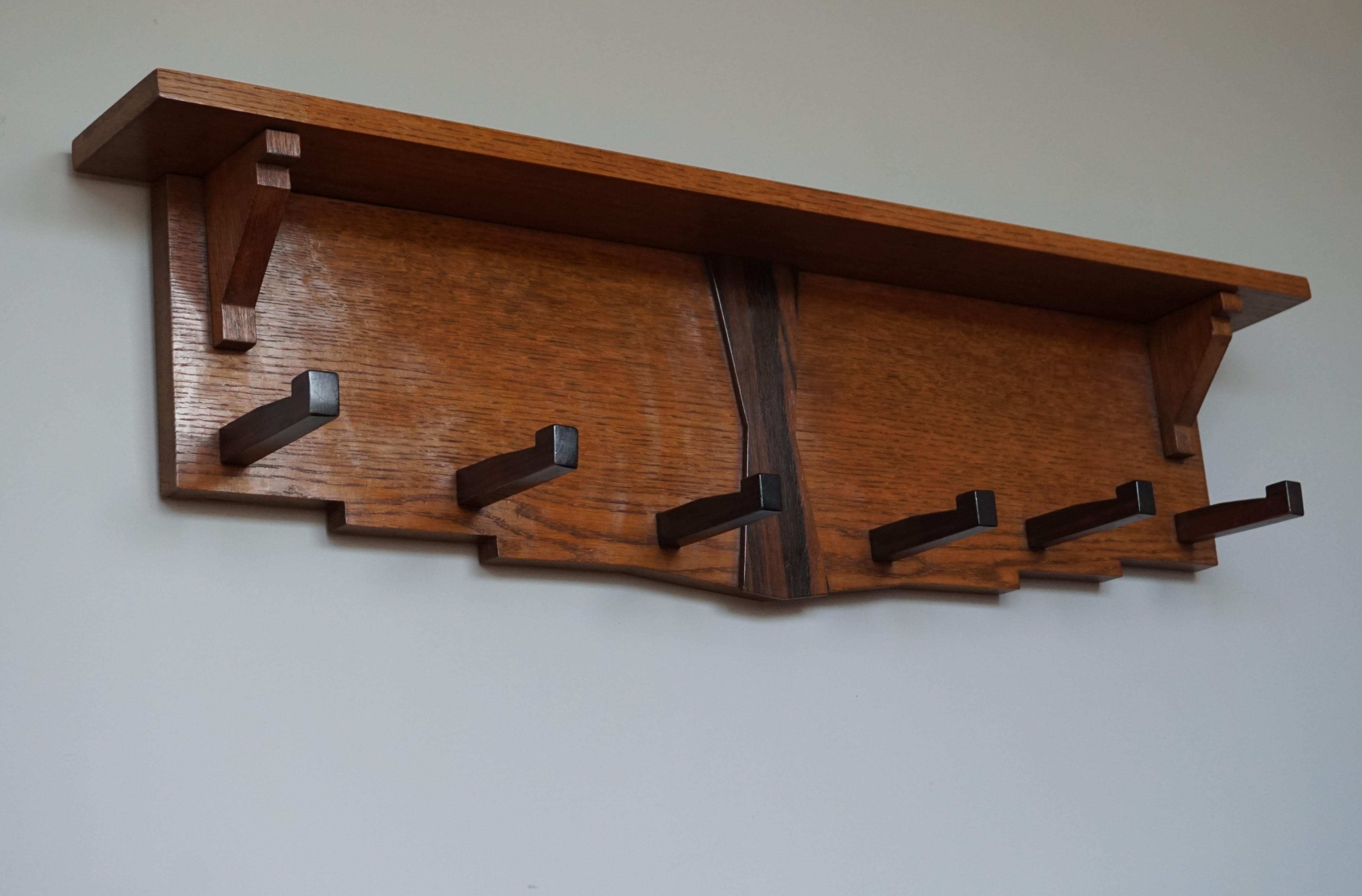 Beautiful design and warm colors, Art Deco coat rack.

This geometrical coat rack from the Dutch Art Deco era could very well appeal to Art Deco collectors the world over. This entry hall statement piece is made of a stunning and light colored oak