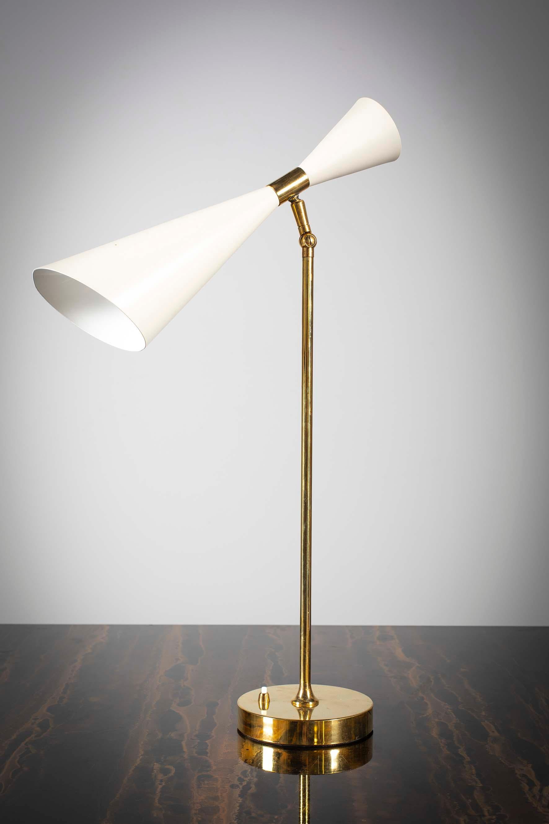 A desk lamp, Italy, 1960, brass and tapering adjustable shade.
