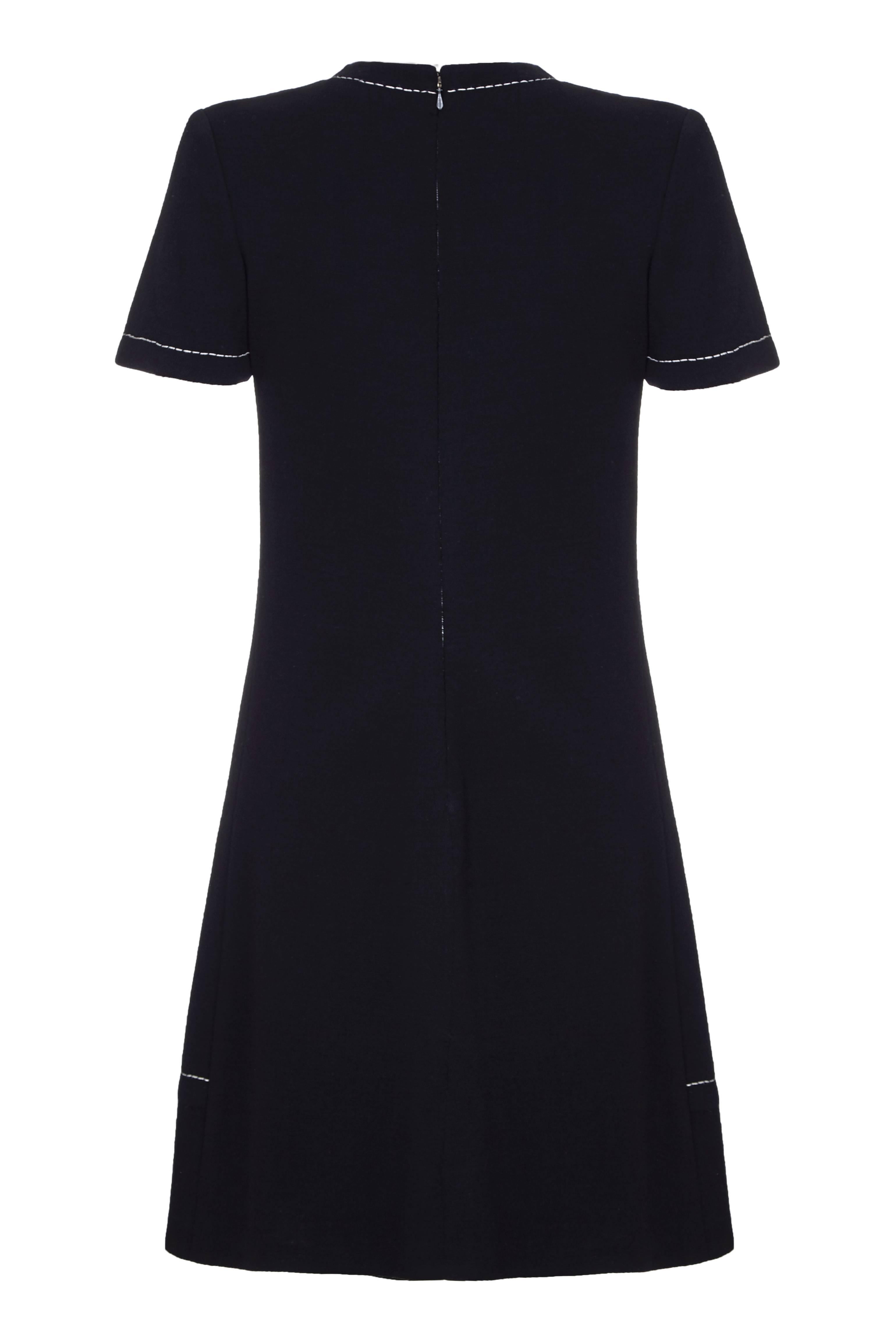 Super stylish 1960s black wool and contrast white stitch jersey dress from the house of Jean Patou.  The designer could be either Karl Lagerfeld or Michel Goma who both designed for the French fashion house during this period.  Fully lined, the