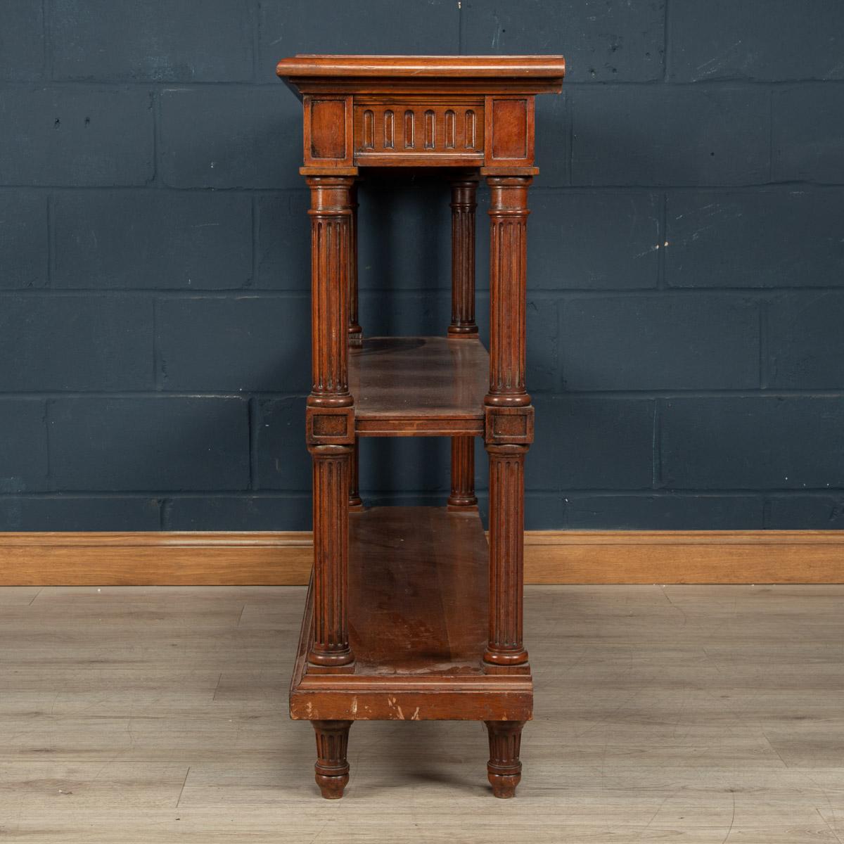 A lovely hardwood three tier dumbwaiter. This French dumbwaiter was made in France around the turn of the last century, probably in walnut and is only 40cm deep making it unusually narrow. The neoclassical design makes it a wonderfully decorative