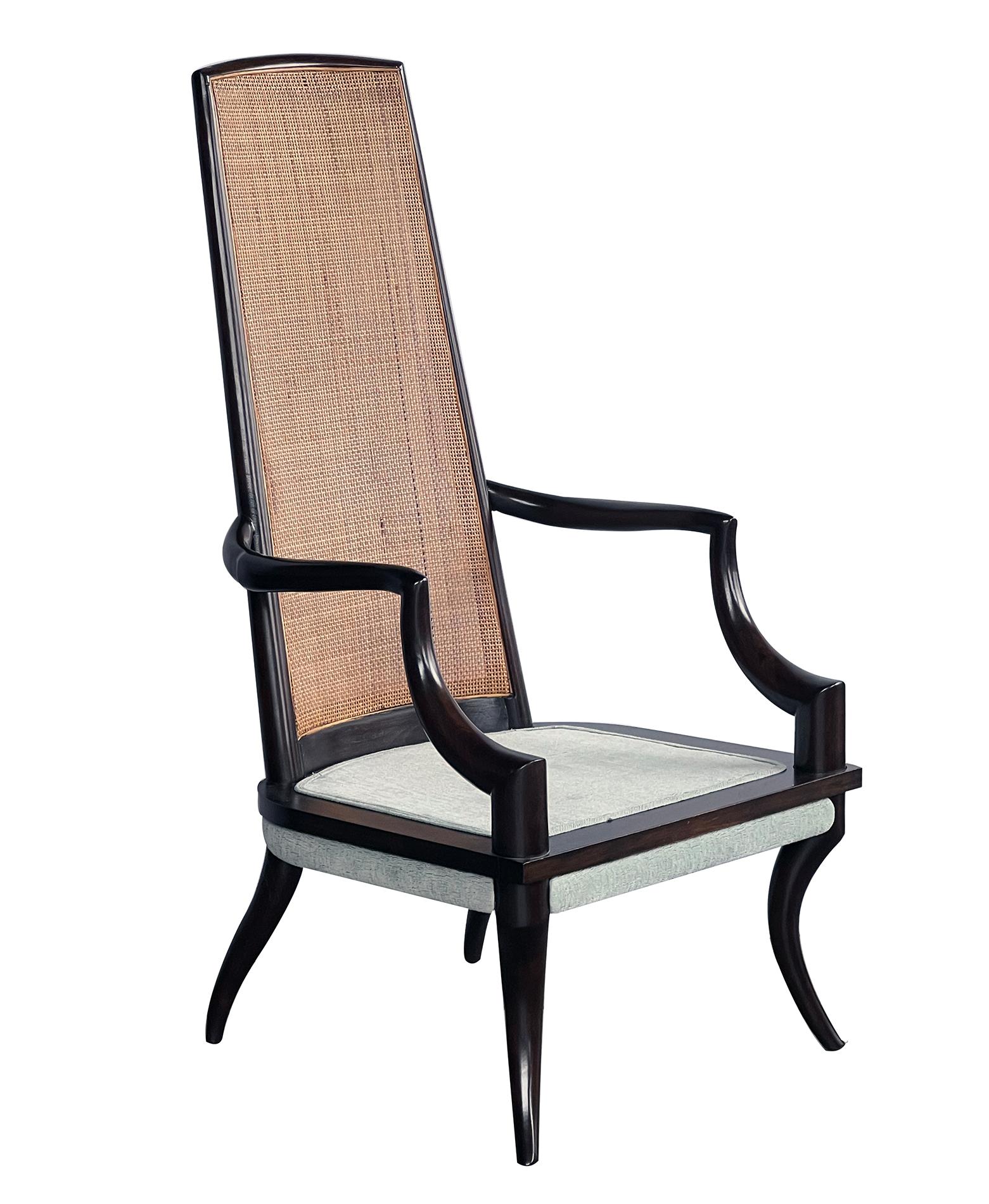 with deep brown lacquered finish, the tall graduated caned back above a loose cushion flanked by down-swept arms all over splayed legs