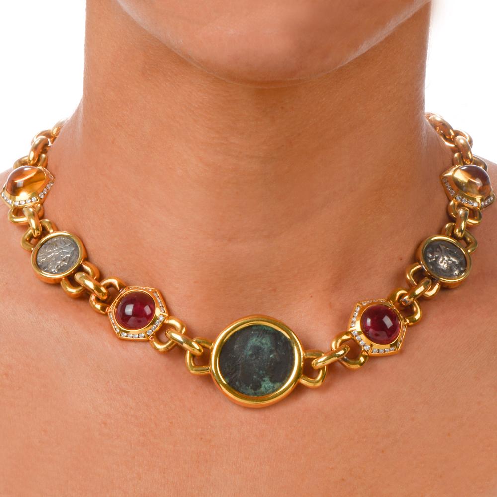  Chic and Fashionable!

This heavy gold choker necklace is composed of three ancient Greek silver coins accompanied by two genuine cabochon Tourmalines approx. 22.00 carats and two Citrines weighing

approx. 22.00 carats.

The gemstones are