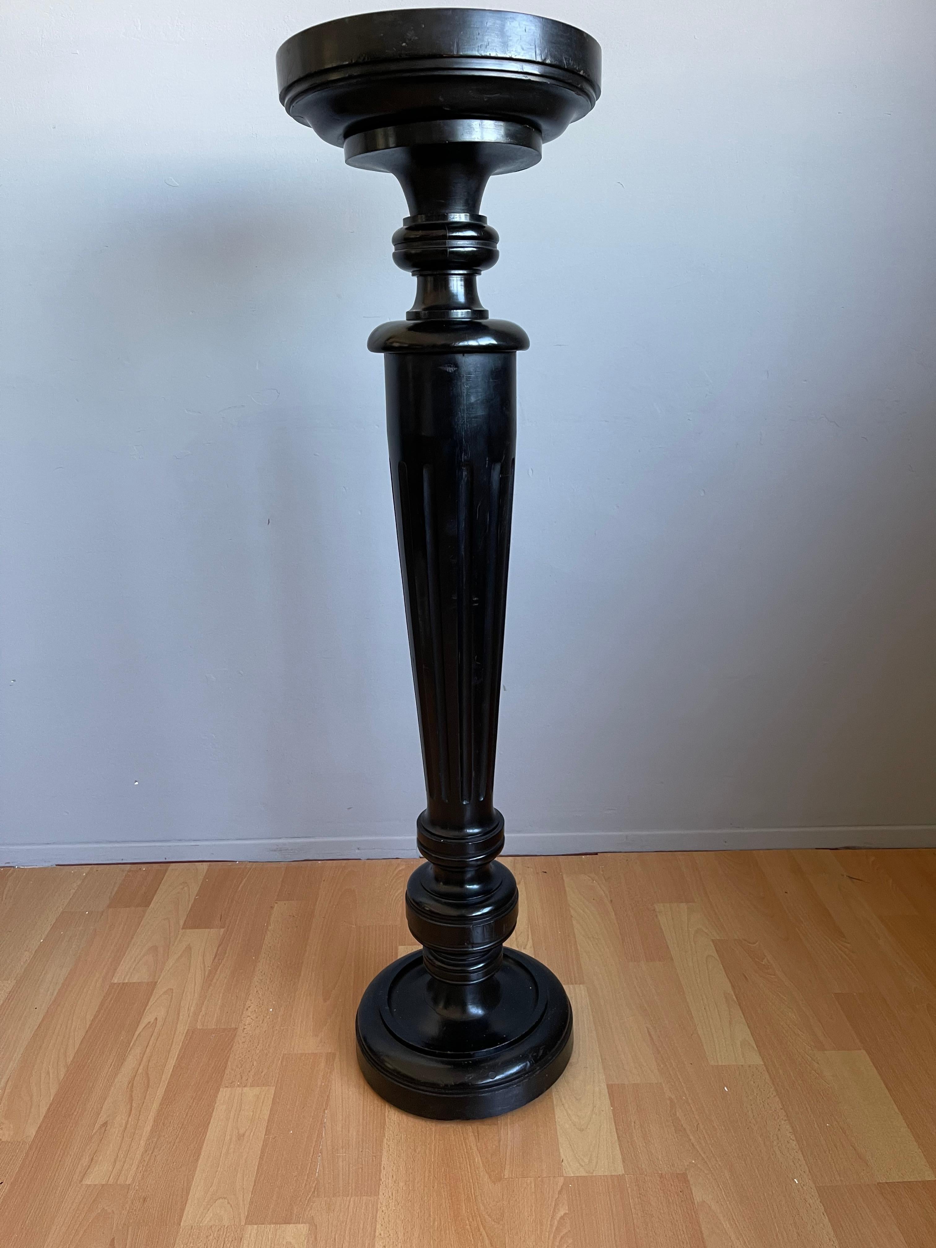 Wonderful column for displaying a work of art or otherwise.

This antique and classical design pedestal is perfect for showcasing an antique sculpture, vase or bust. Most colors will contrast beautifully against the fully ebonized, black surface