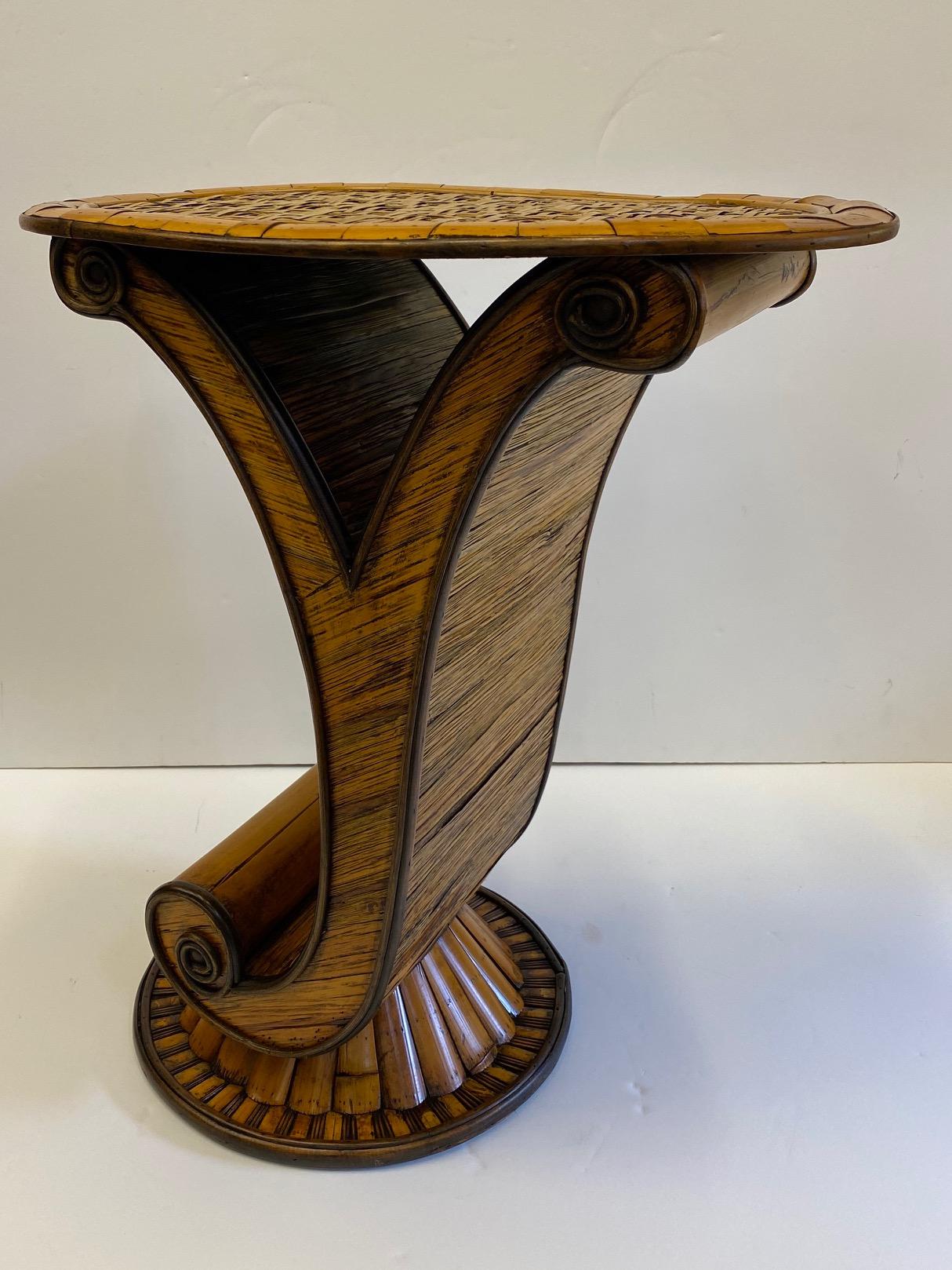 A wonderful rattan side or drinks table with stylish island flair having a Y-shaped bases with curl at the bottom. Great textural piece with rare form.