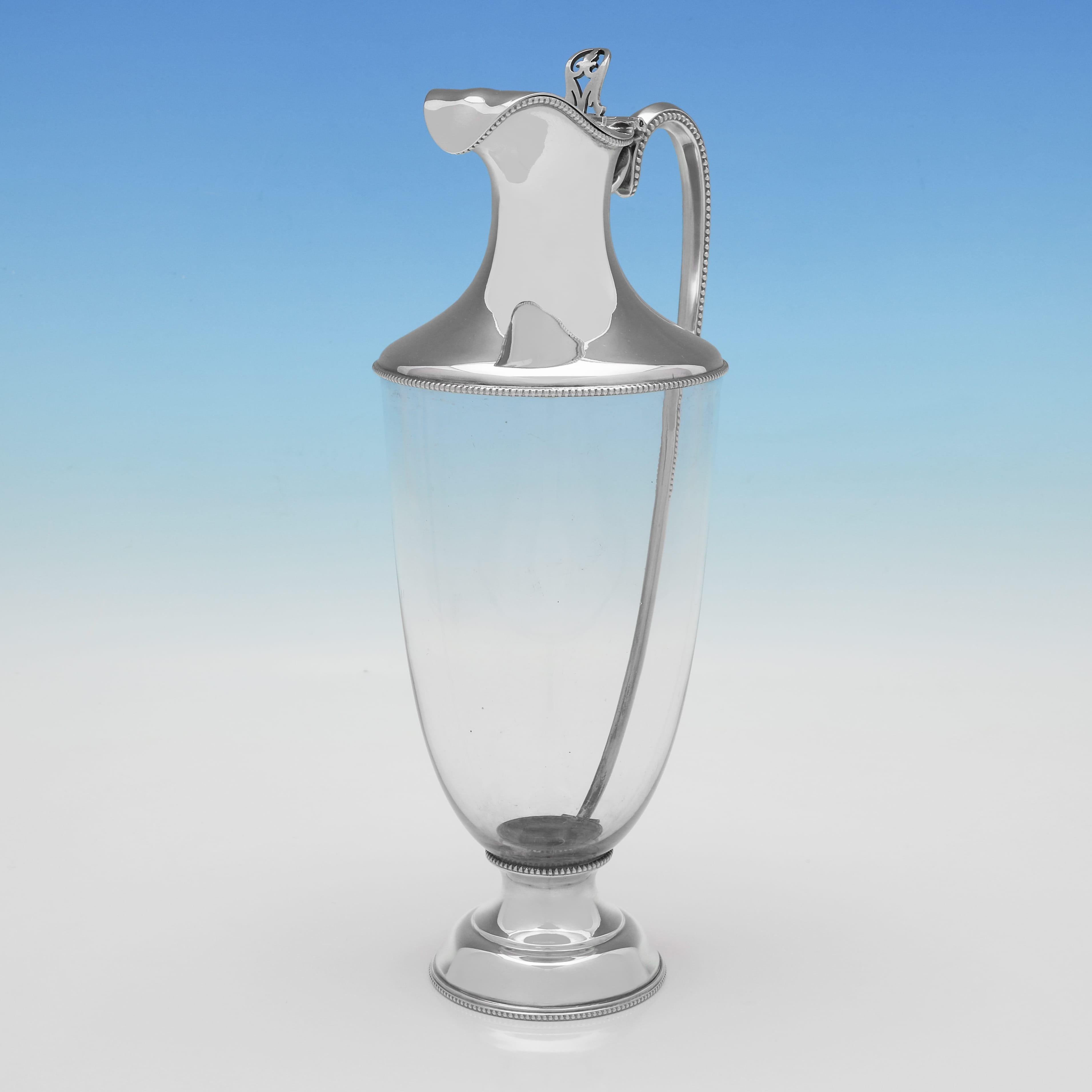 English Stylish and rare pair of antique sterling silver claret jugs made in 1918 For Sale