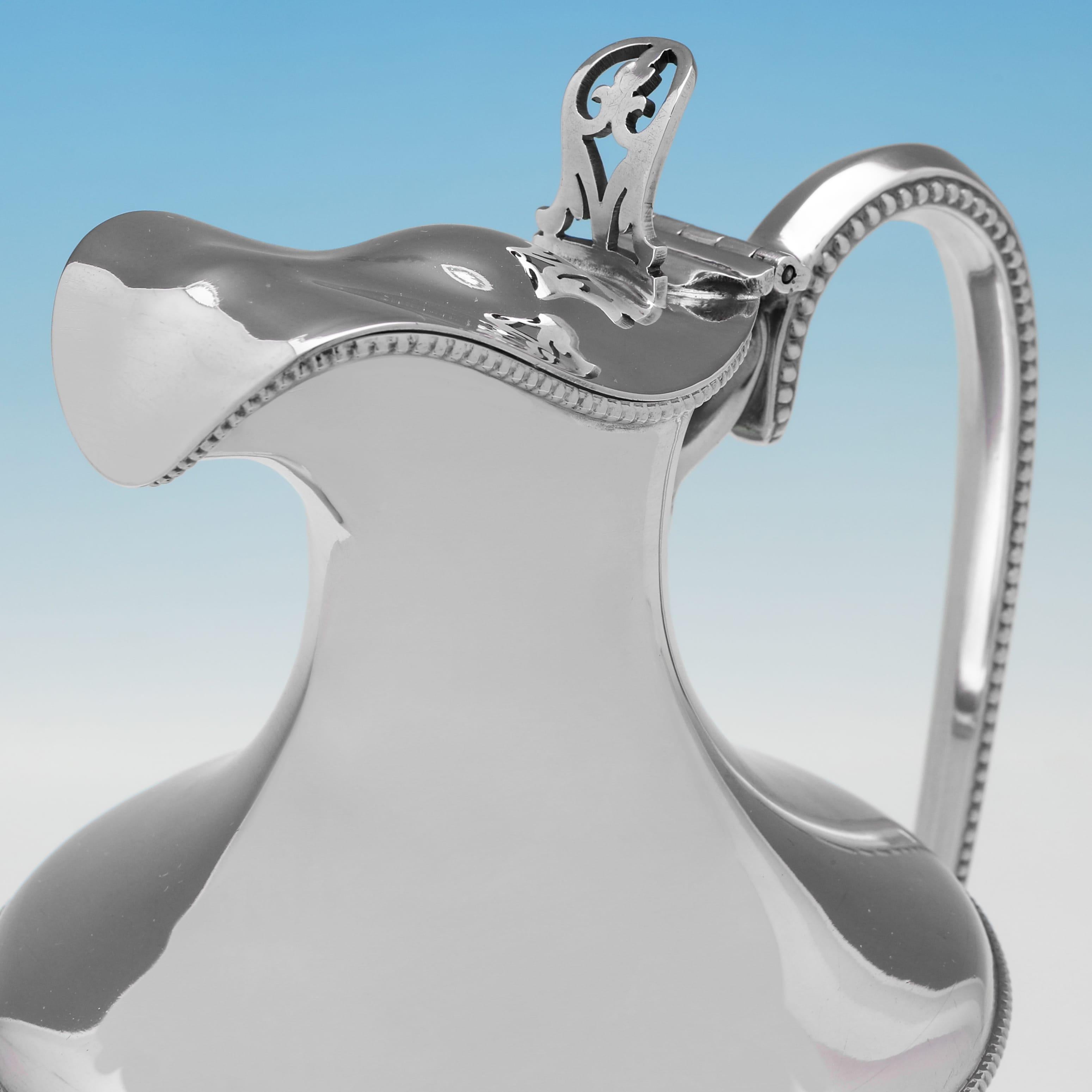 Early 20th Century Stylish and rare pair of antique sterling silver claret jugs made in 1918 For Sale