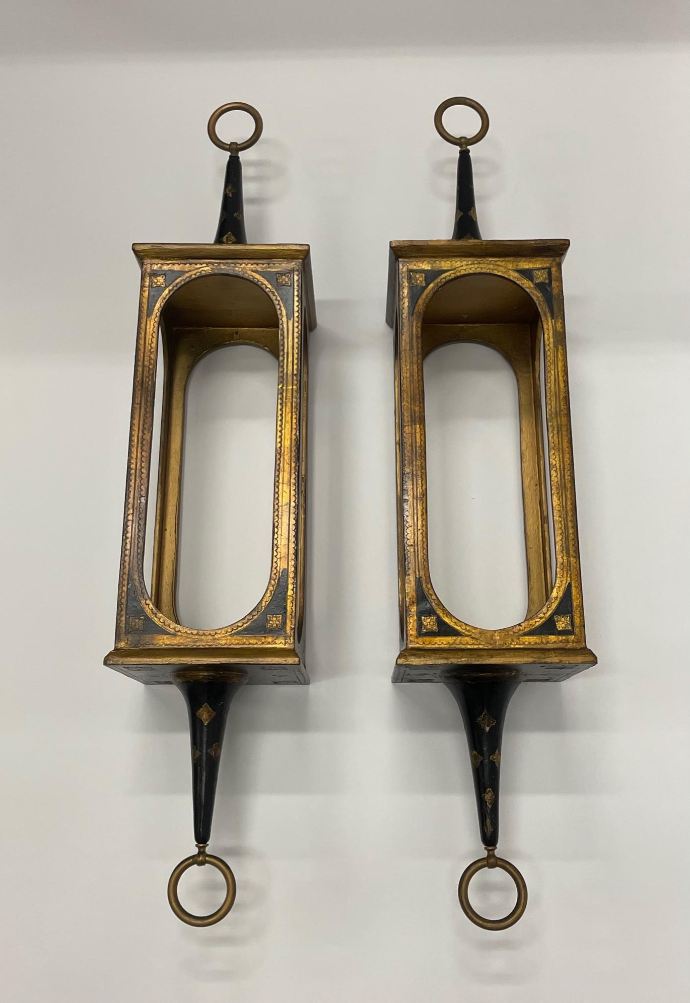 Romantic pair of hanging Venetian lanterns made of gilded and ebonized wood. Meant for candlelight.