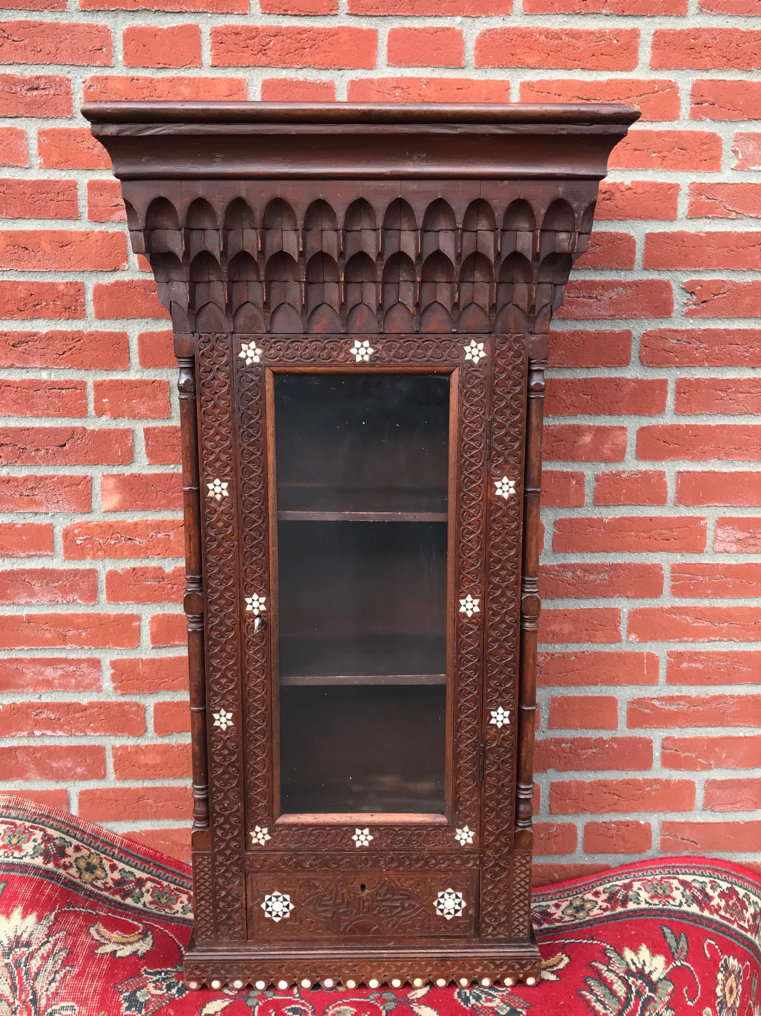 Stylish Antique Eastern Style Wooden Wall Hanging Cabinet with Intricate Details For Sale 2