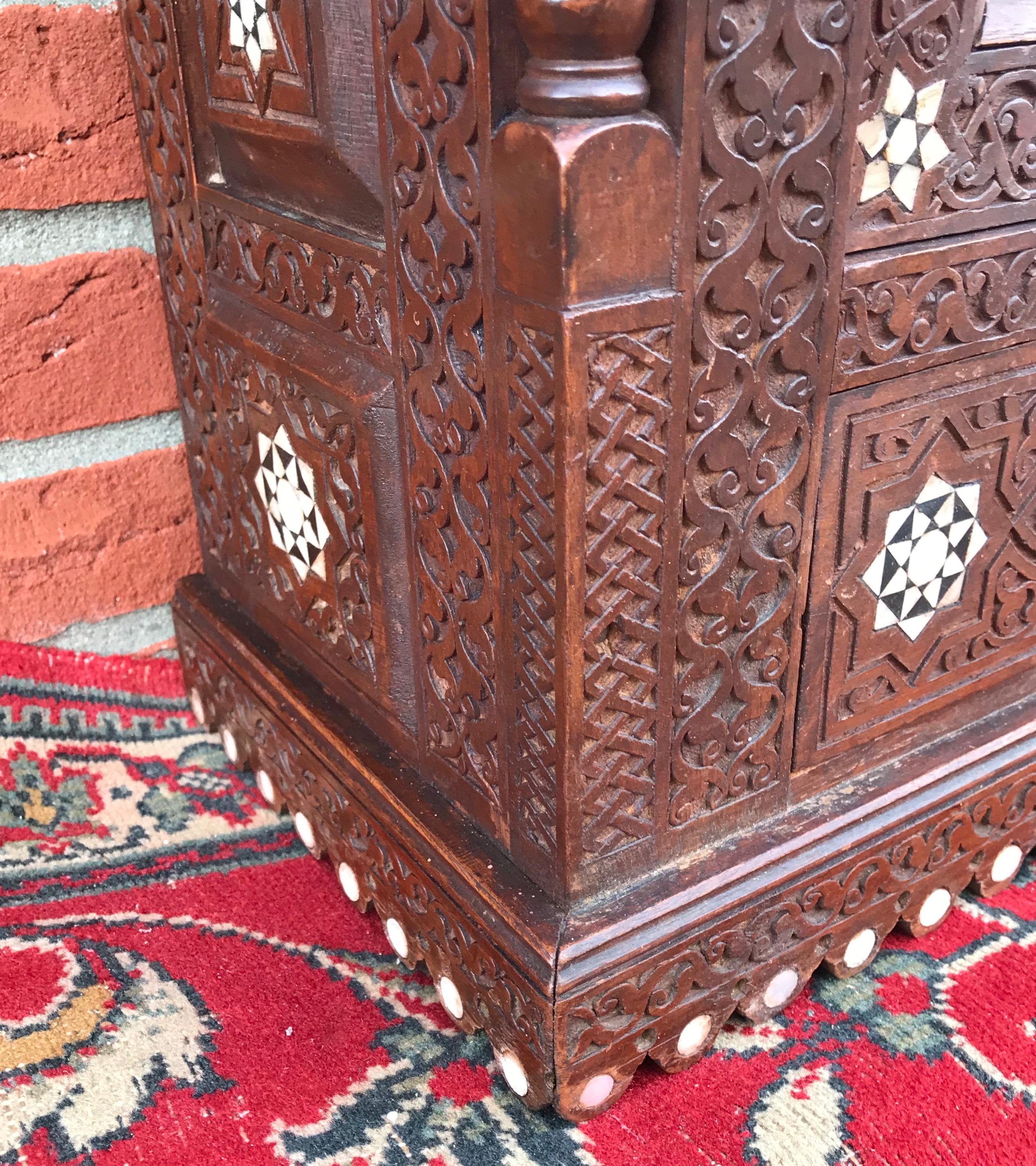Stylish Antique Eastern Style Wooden Wall Hanging Cabinet with Intricate Details For Sale 9