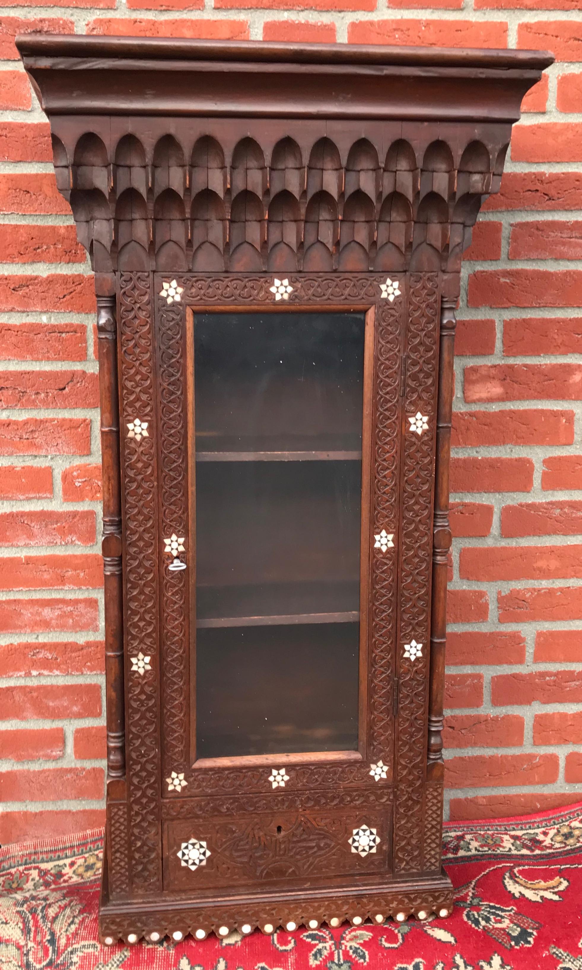 Stylish Antique Eastern Style Wooden Wall Hanging Cabinet with Intricate Details For Sale 11