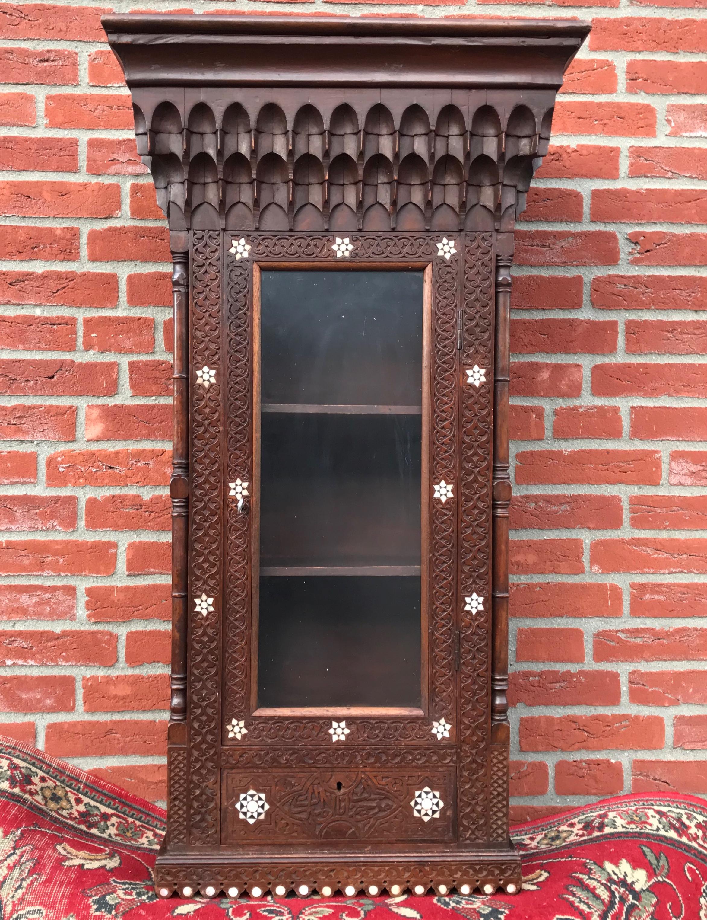 Very rare and excellent condition, 

This all-handcrafted cabinet with a stunning decor of foliate carving and inlaid, Eastern style motifs is completely original and can be used for all kinds of purposes. It must have taken a highly skilled artisan