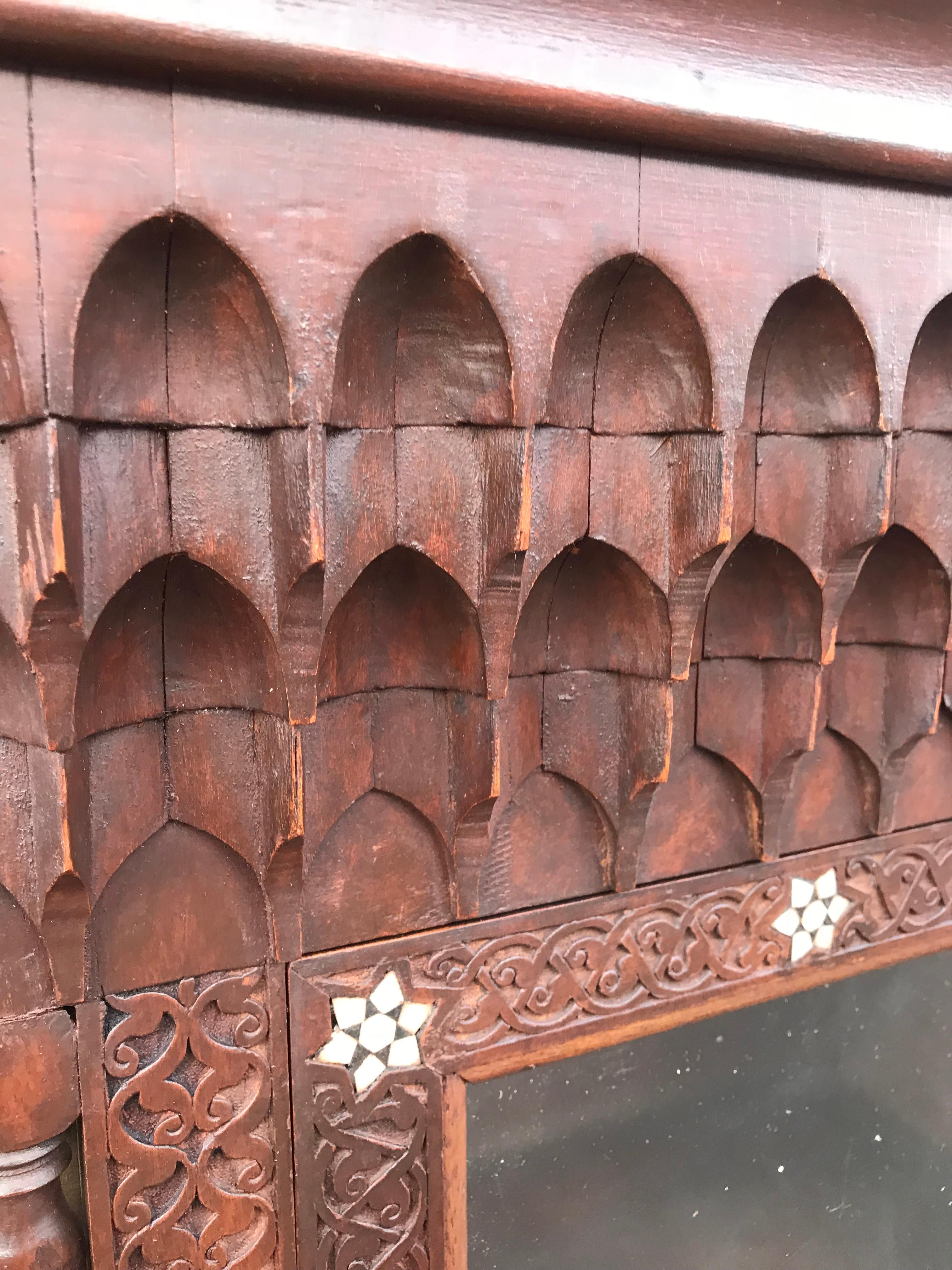 Hand-Carved Stylish Antique Eastern Style Wooden Wall Hanging Cabinet with Intricate Details For Sale