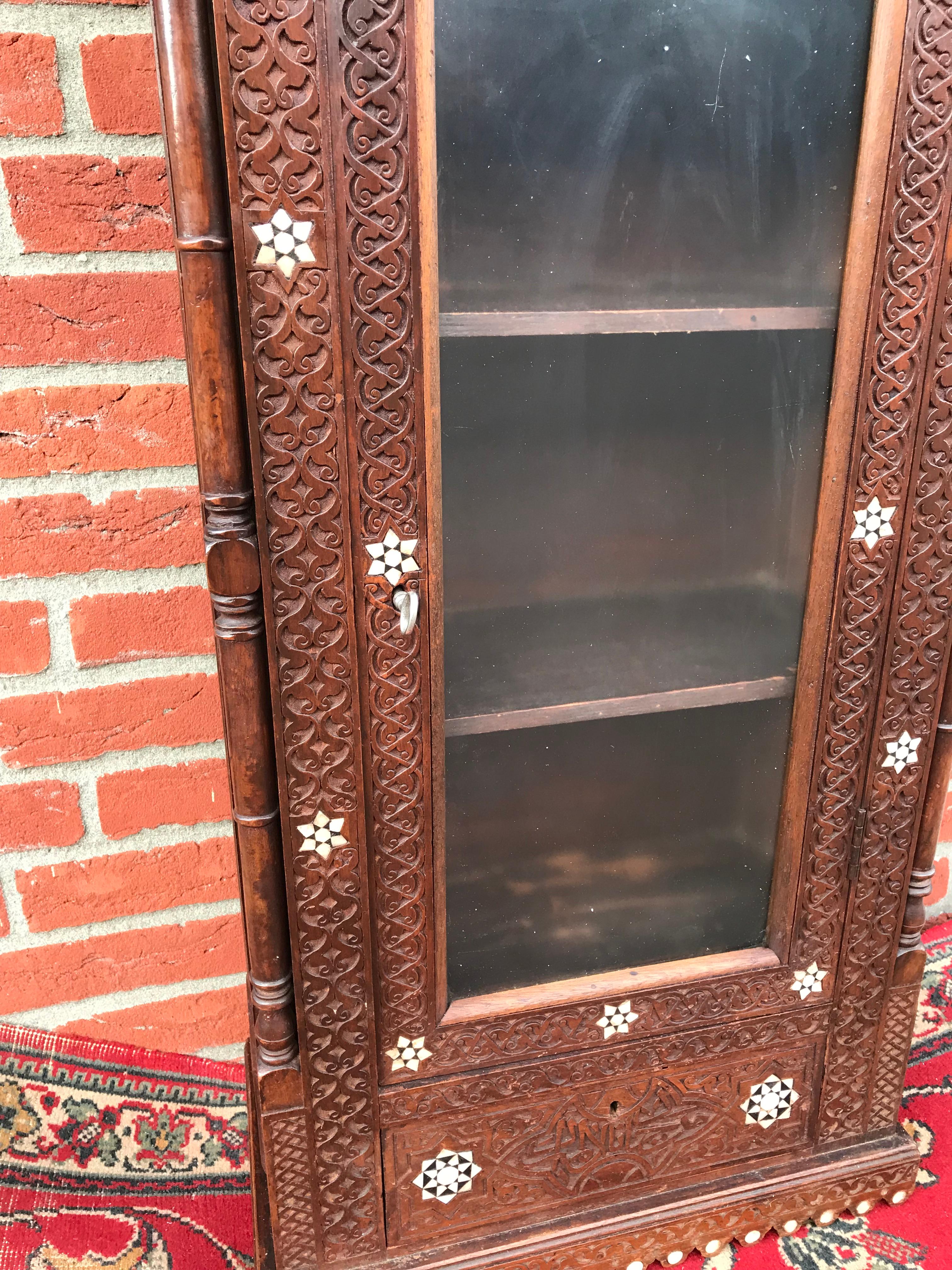 19th Century Stylish Antique Eastern Style Wooden Wall Hanging Cabinet with Intricate Details For Sale