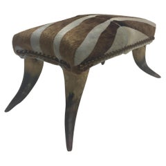 Stylish Antique Horn Footstool with Cowhide Zebra Upholstery