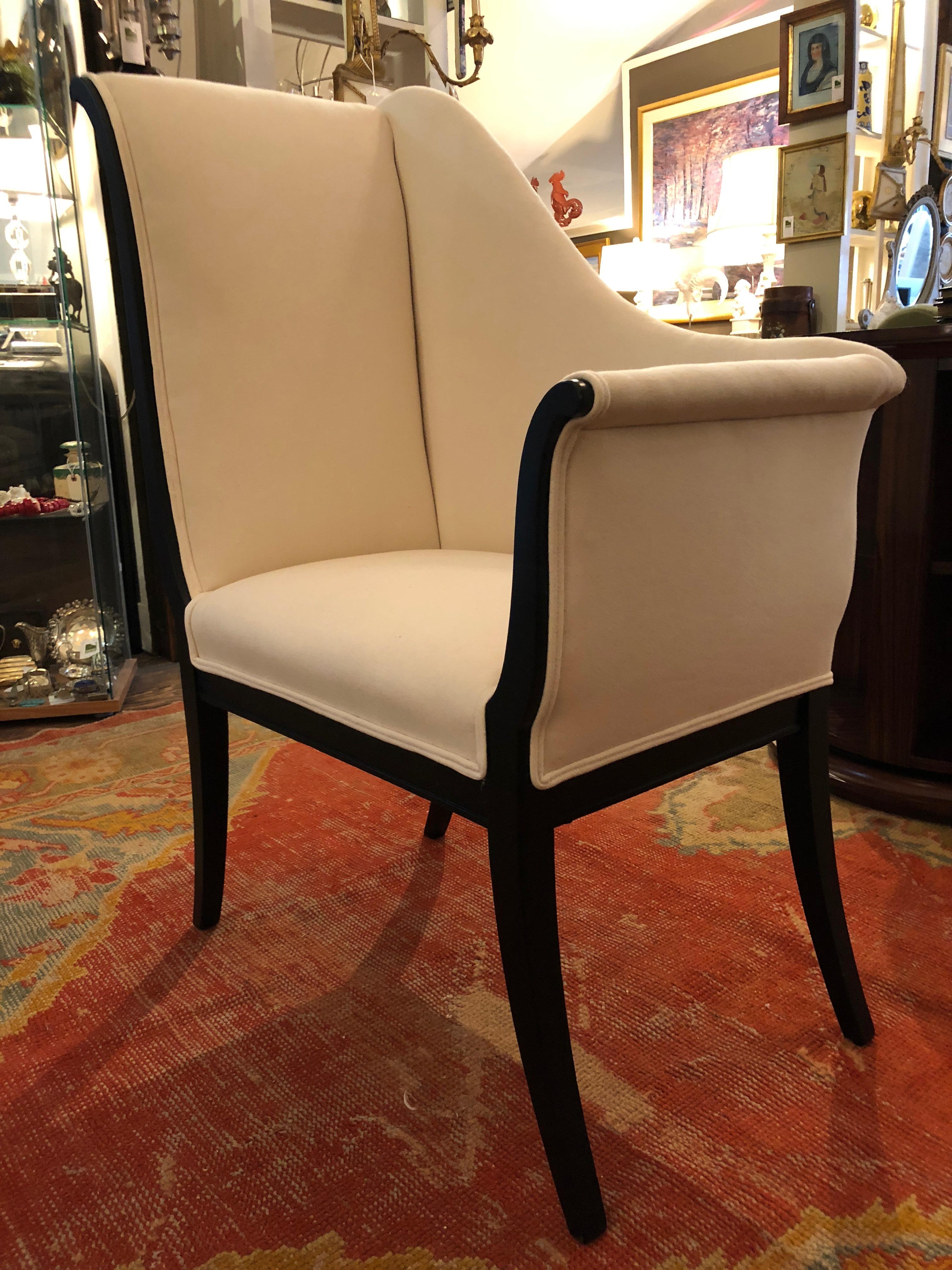 The show stealer chair in the room, a glamorous asymmetrical Recamier chair with elegant sloping back, 41.5 at the highest point and 27 at the arm. Ebonized graceful slightly splayed legs and new crisp white duck heavy gauge cotton upholstery.
