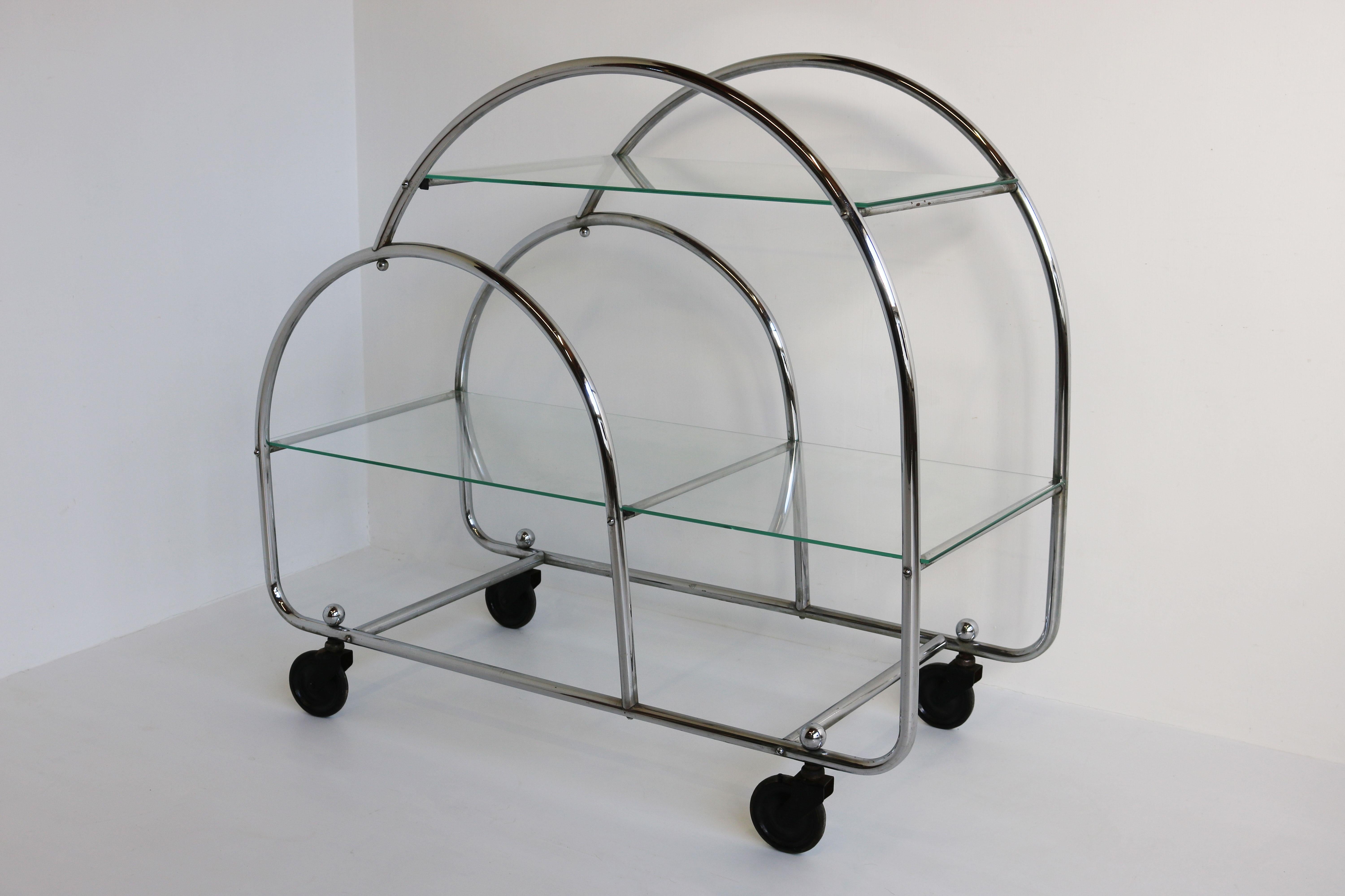 Gorgeous fully original Art Deco Bauhaus Bar cart in Chrome & glass from the 1930s. 
Marvelous Art Deco design with the chrome hoops & two tiers of glass. 
Gorgeous timeless antique piece that will make a lasting impression. 
Will fit in almost