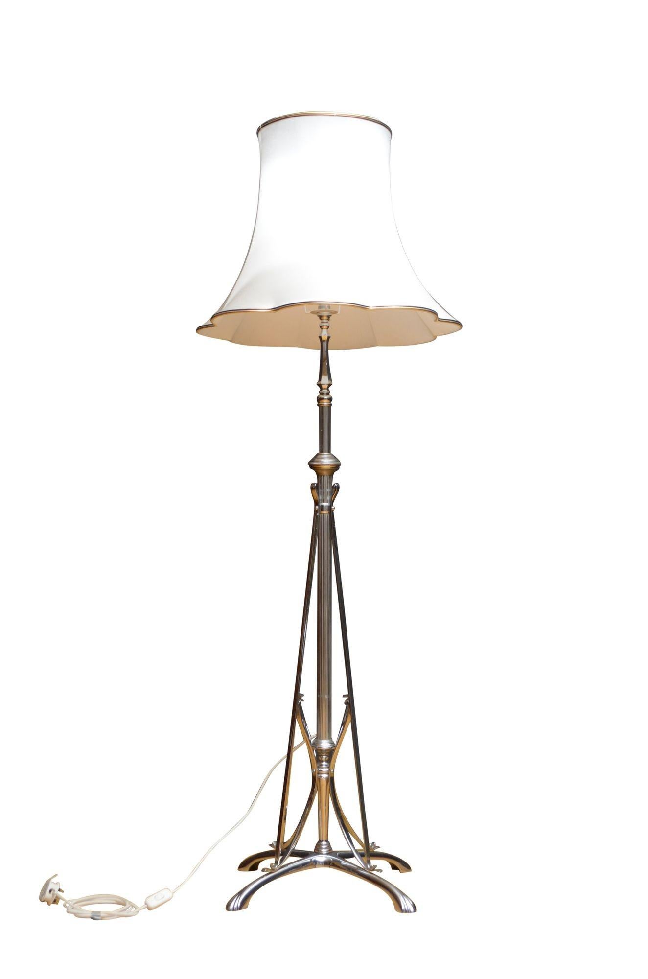K0231 Rare antique chrome plated height adjustable standard lamp, having reeded column with adjustable mechanism, four decorative supports and four downswept legs with paw feet. This antique lamp comes with a new shade. Newly wired and PAT tested,