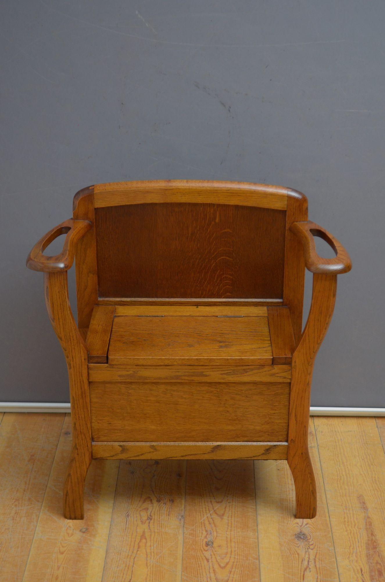K0580 Very attractive Art Deco hall seat by Kubbyland, having shaped and panelled back and lift up seat with storage compartment, all flanked by open arms with umbrella holders, all standing on shaped legs enclosing original drip trays. This antique