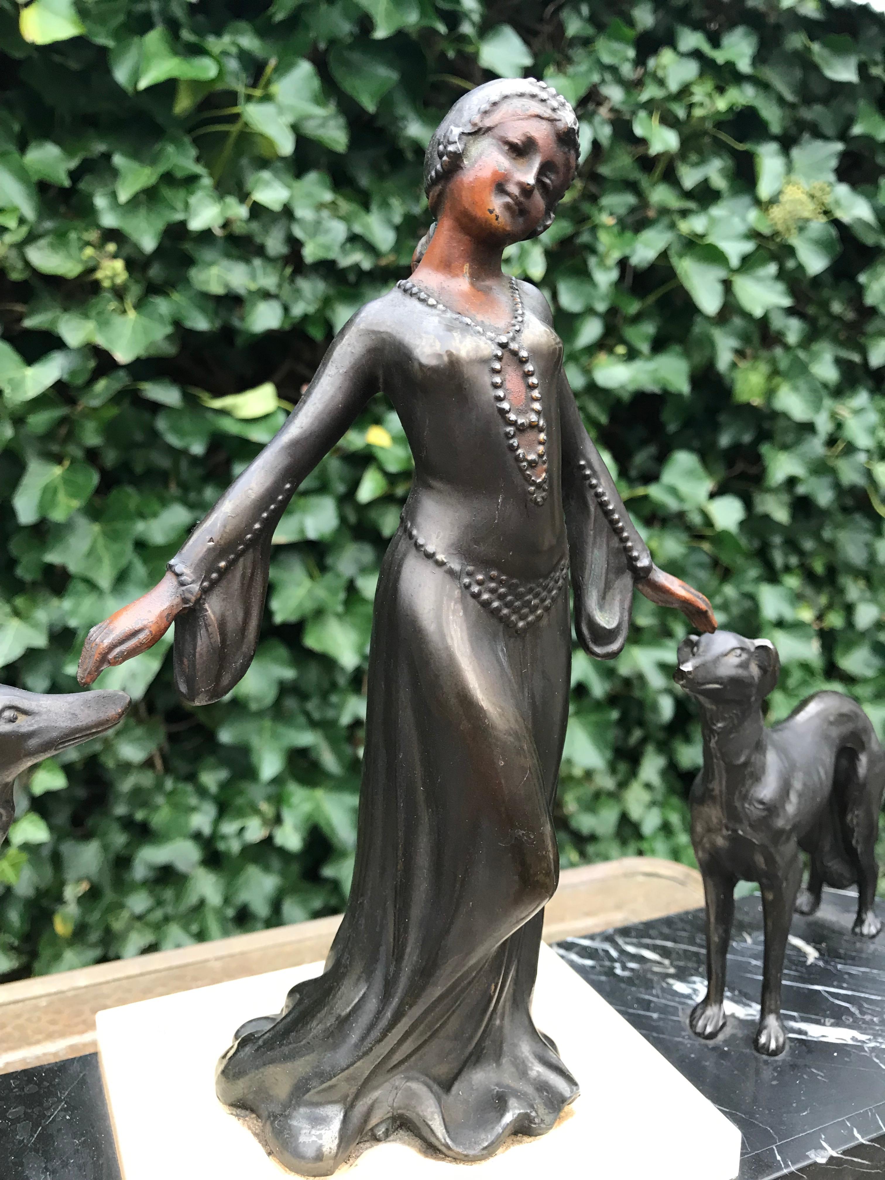 Wonderful work of art for displaying on a side table, dresser etc.

This Art Deco sculpture embodies everything we love about art and antiques. The beautiful and realistic, young female in her 1920s dress and hairdo is a work of art (deco) by