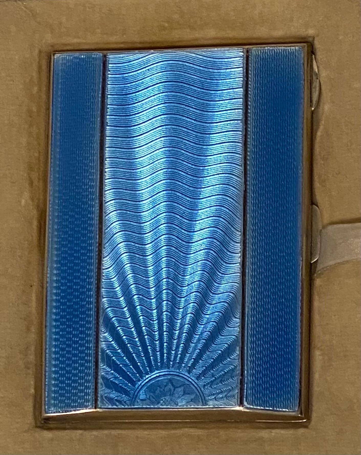 Fabulous! In absolutely beautiful, unused condition. The deep blue guilloche enamelling on this wonderful powder compact and cigarette case is immaculate. Iconically Art Deco each piece is stunning!. Marked with the hallmark of respected silversmith