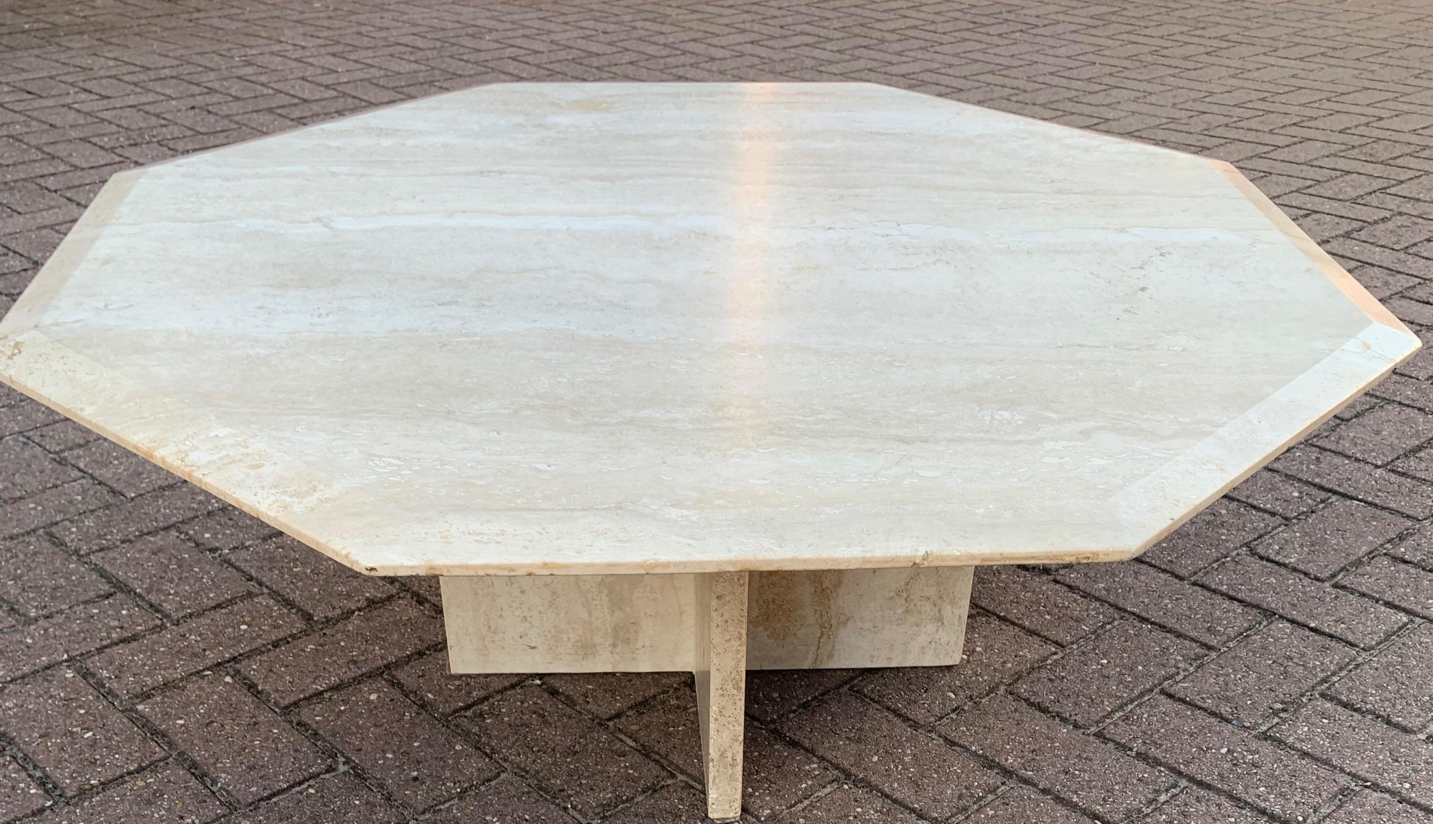 Stylish and functional Italian, travertine hardstone table. 

This large size travertine table with 'beveled' sides and an attractive, symmetrical cross-base is in good to excellent condition. Because of the timeless design this hardstone table can