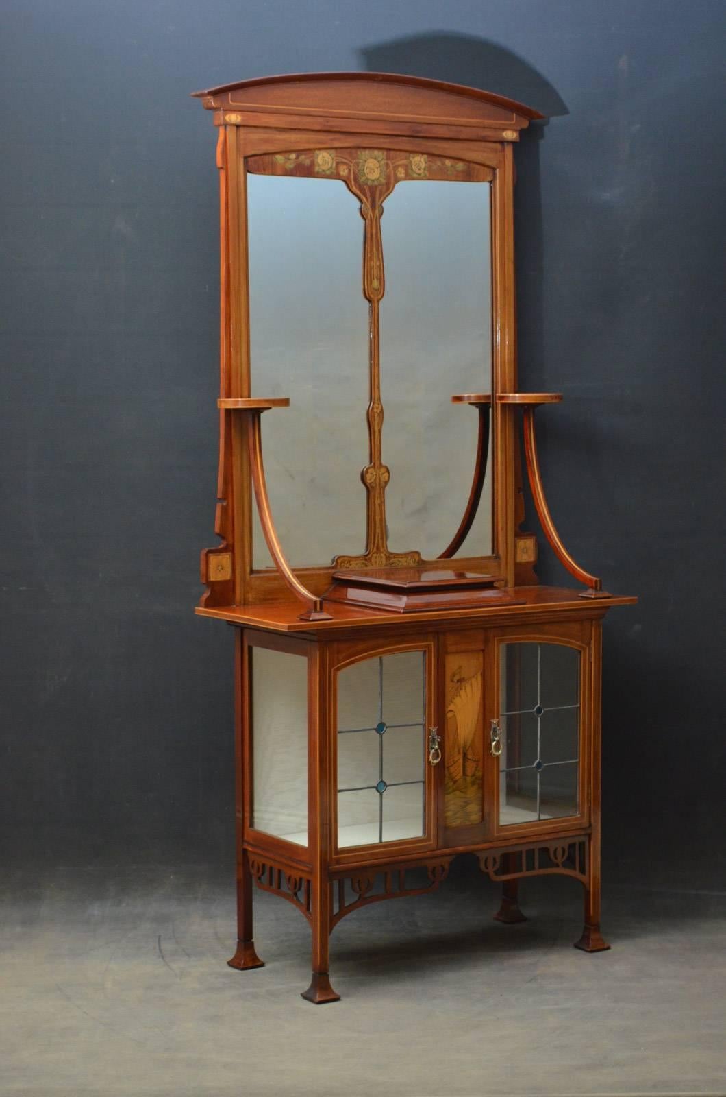 Sn4337 stylish Art Nouveau mahogany and marquetry hall cabinet or side cabinet, having arched cresting above divided mirror flanked by a pair of circular platforms on downswept supports, the projecting base having finely inlaid centre panel