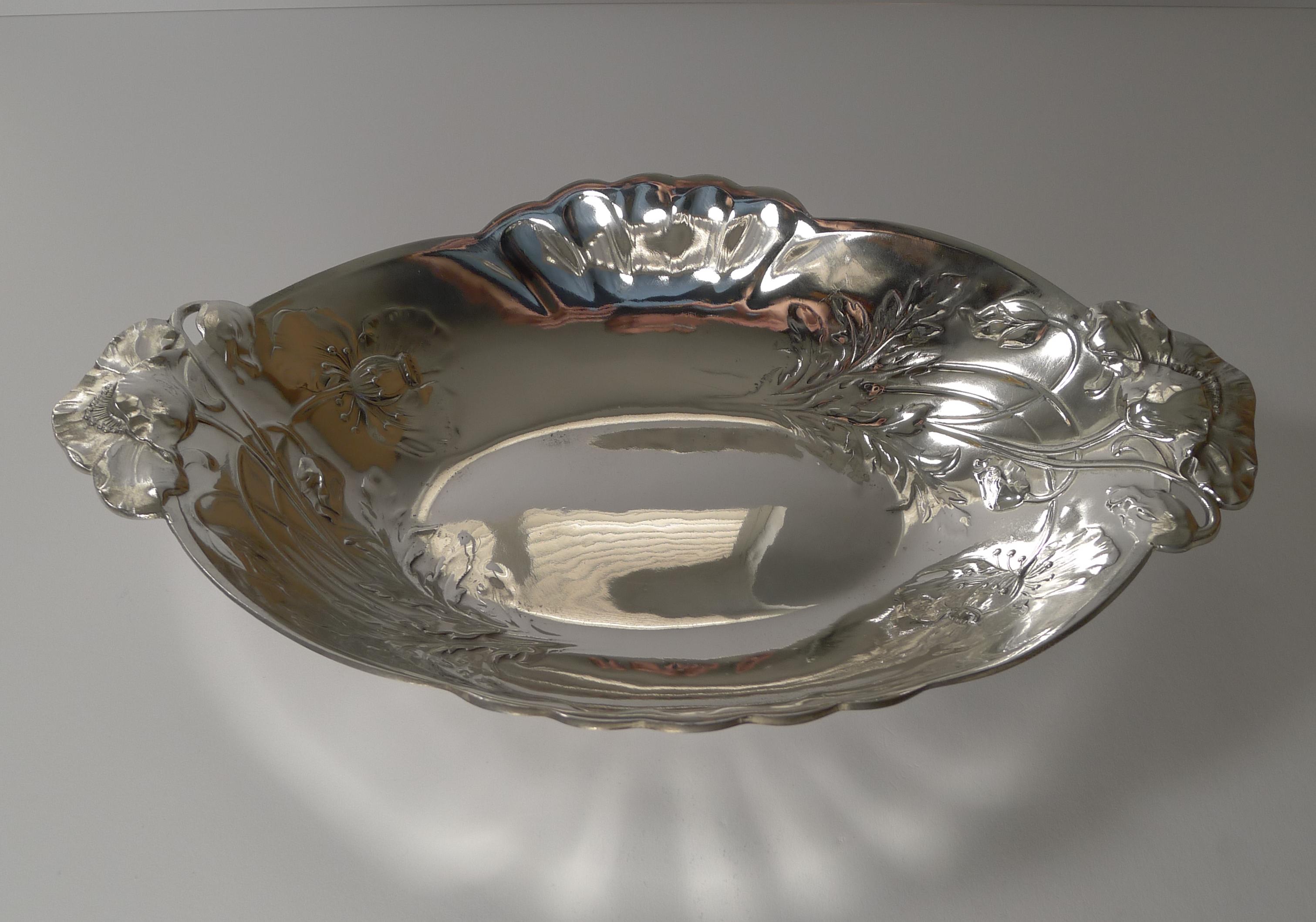 A magnificent French Christofle Gallia bread basket beautifully decorated with a stylish Art Nouveau Poppy design.

Just back from our silversmith's workshop where it has been professionally cleaned and polished, restoring it to it's former