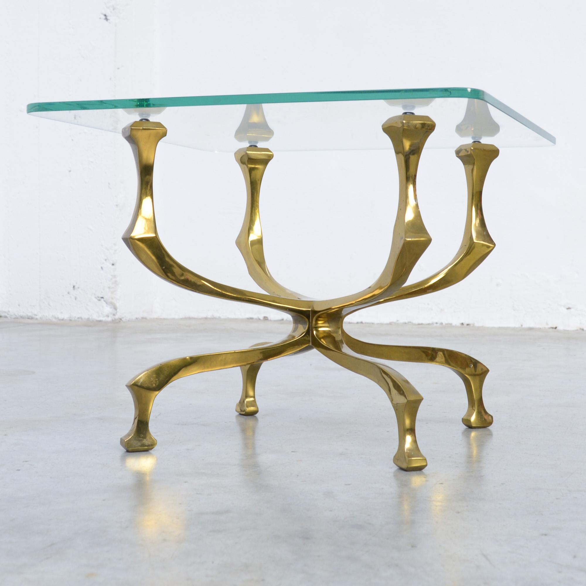 This stylish side or coffee table was created by Willy Daro in the 1970s.
The crystal glass top rests on the artistically made bronze base is. The table is signed by the artist and in very good condition. The original glass top has some minor