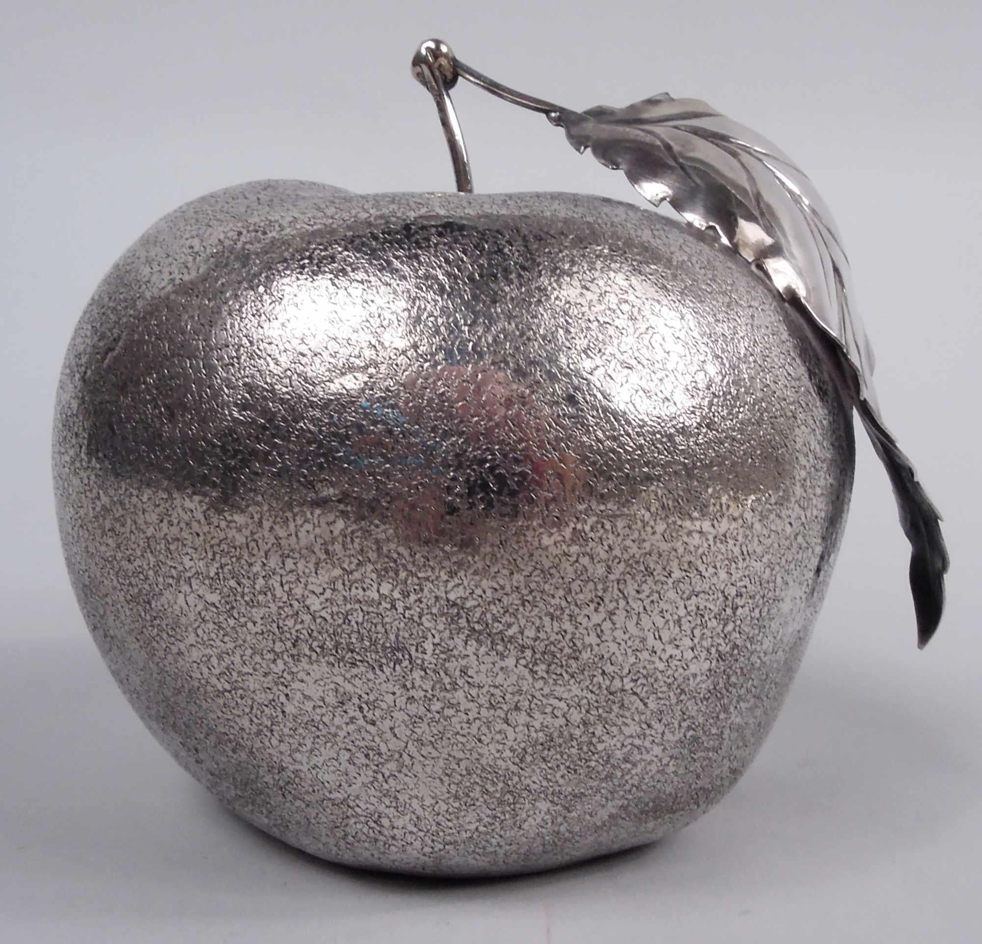 Stylish Italian 800 silver lighter. Large apple with naturalistic irregular form and striated skin. Long stem with leaf. Underside has inset lighter. Italian maker’s mark (1944-68) as well as script Buccellati stamp. Gross weight: 6.3 troy ounces. 