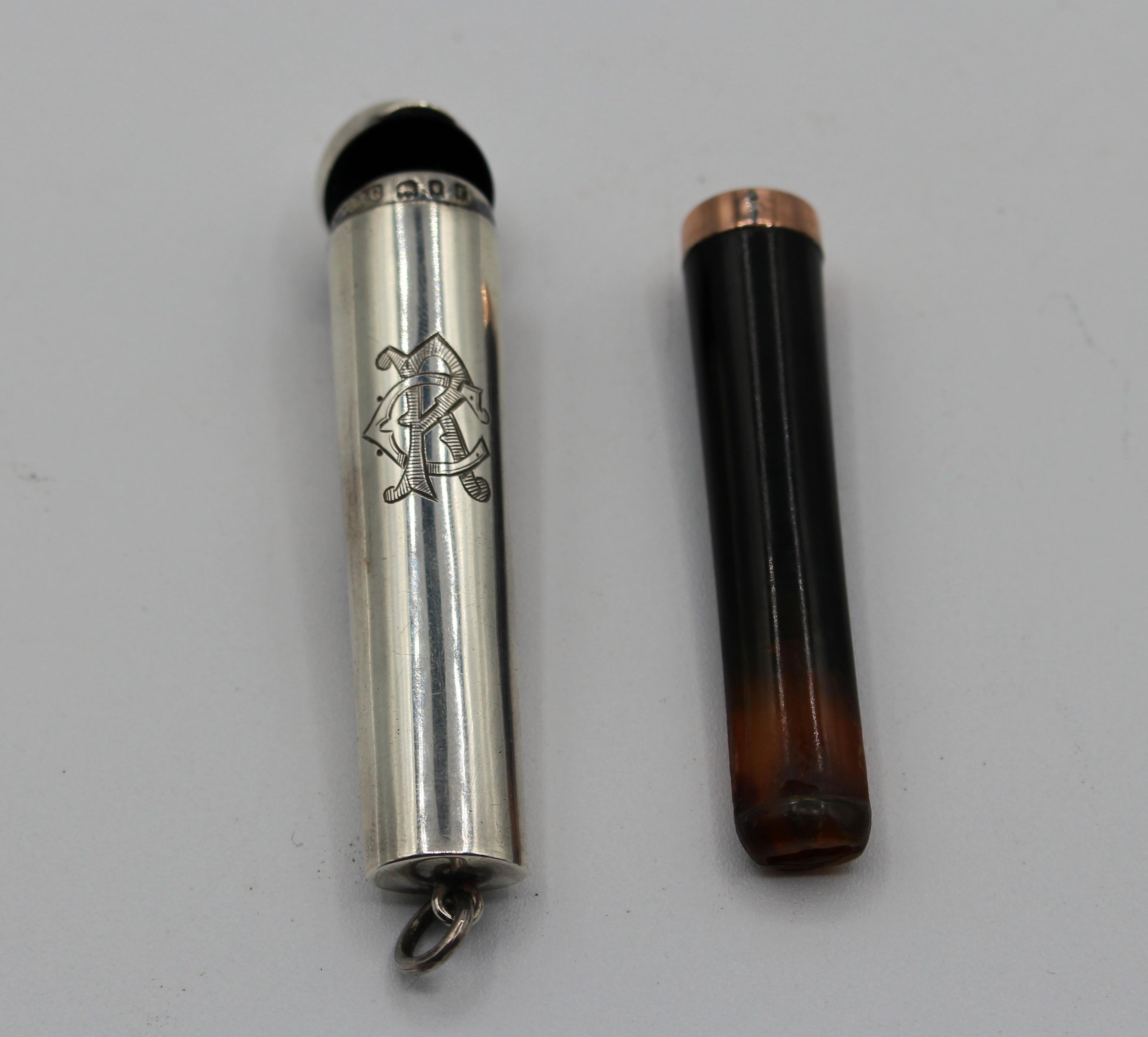A stylish carved amber & gold cigarette holder, original sterling silver case. Made in 1920 in London by Albert Cohen & Charles, Thavies Inn, Holborn Circus. Period monogram. 