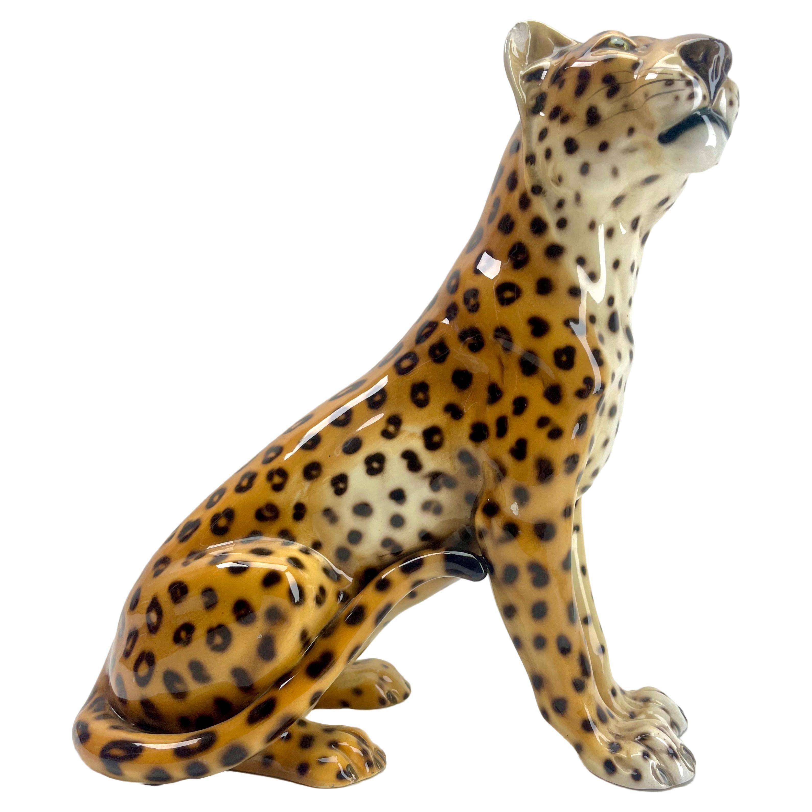 This stylish Leopard sculpture dates to the late 1950s-1960s and was Fabricated in Italy Signed. Ronzan numbered 1211/3
This porcelain sculpture of a Leopard is made by the Italian artist Ronzan. It can be dated in the 1950s. 
The elegant sitting