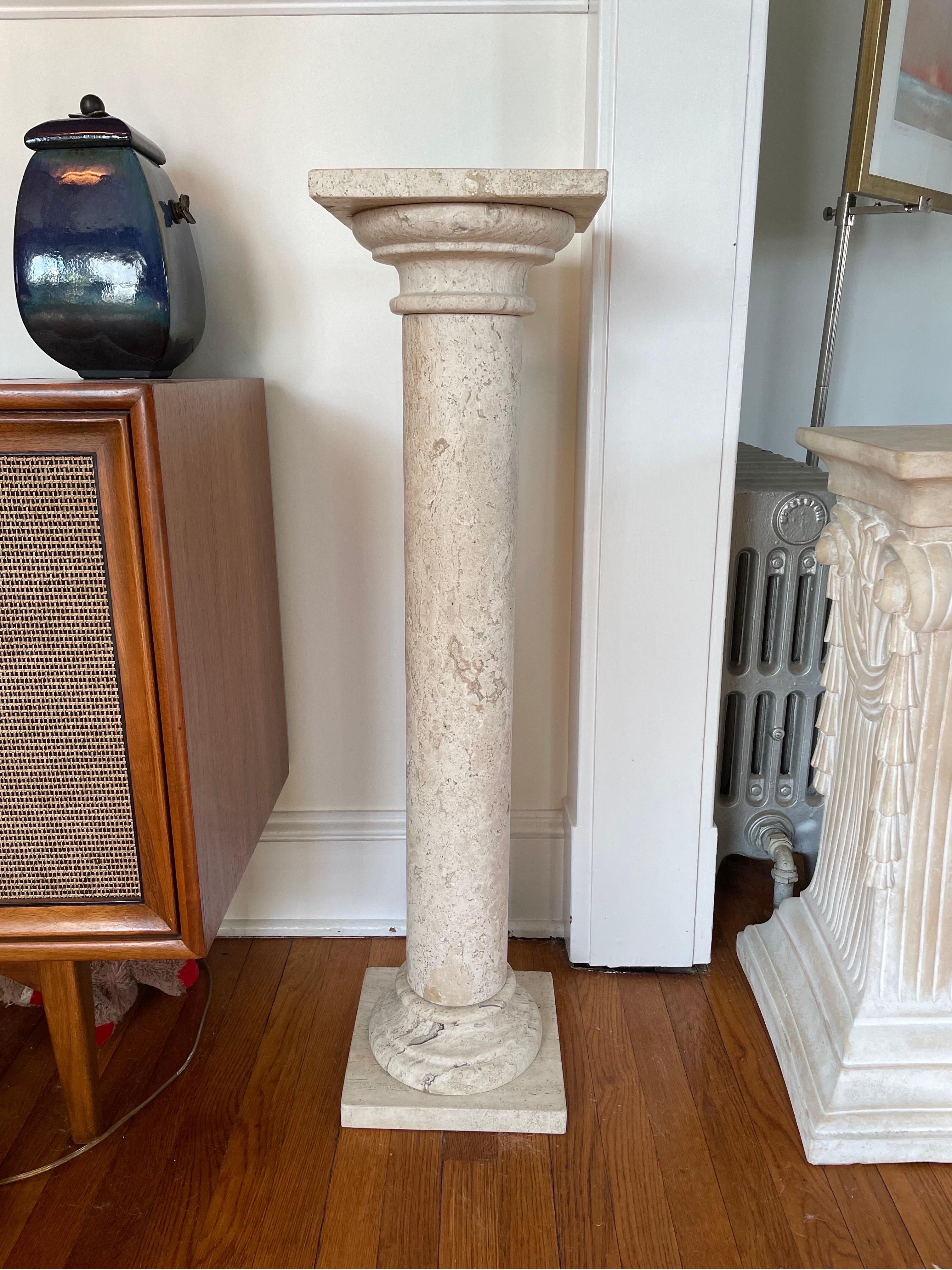 Classic Roman or Neoclassical Travertine Column Pedestal. Beautiful markings in the travertine. Rolling pin column sits into base as well as top to allow for easy transport or repositioning. Great to showcase art, or simply leave by itself.