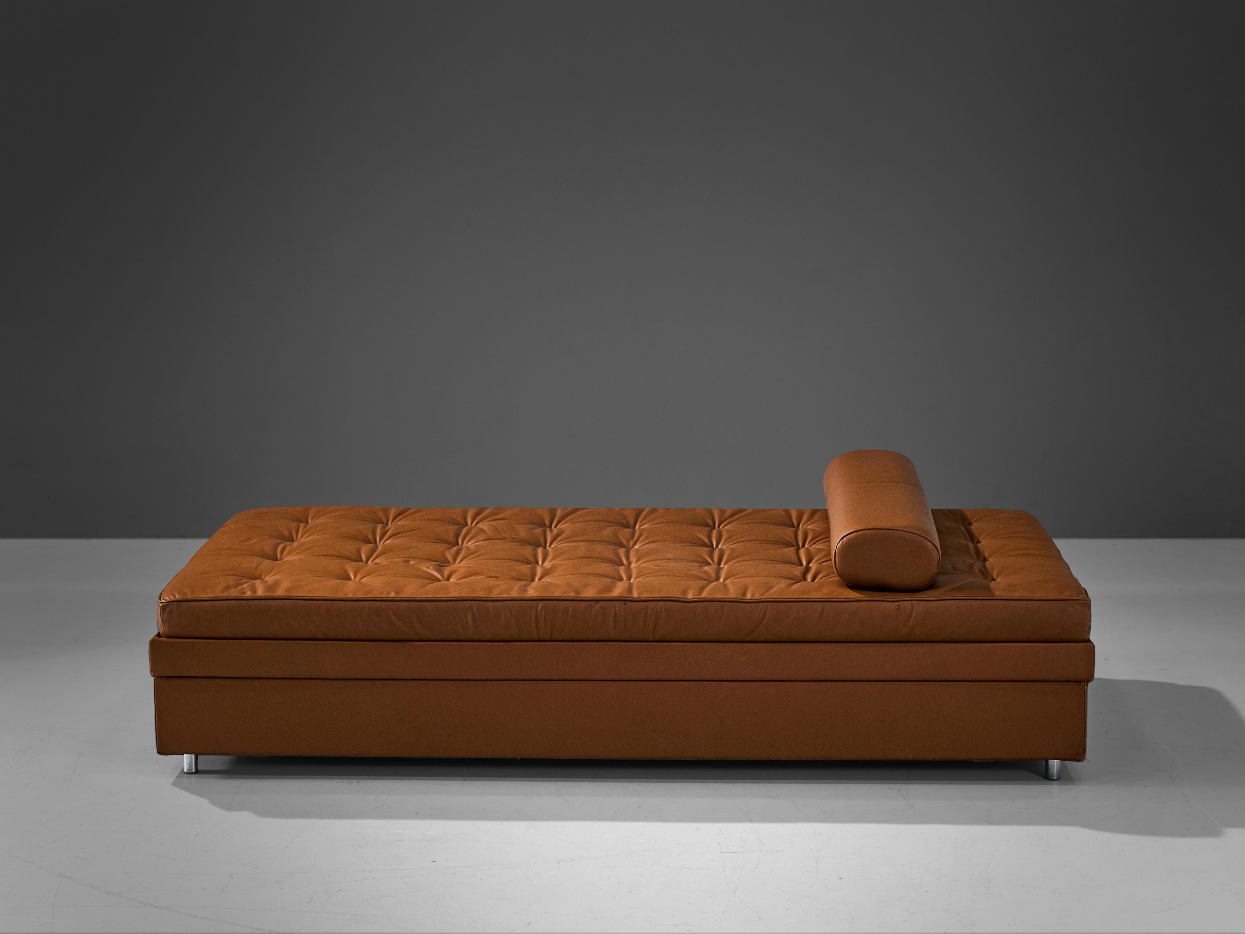 Daybed, leather, chrome, Europe, 1960s

Well designed daybed in stunning cognac leather. The daybed is placed on small, chrome legs that form a striking combination with the tufted cognac mattress. Due to the small legs, a nearly floating expression