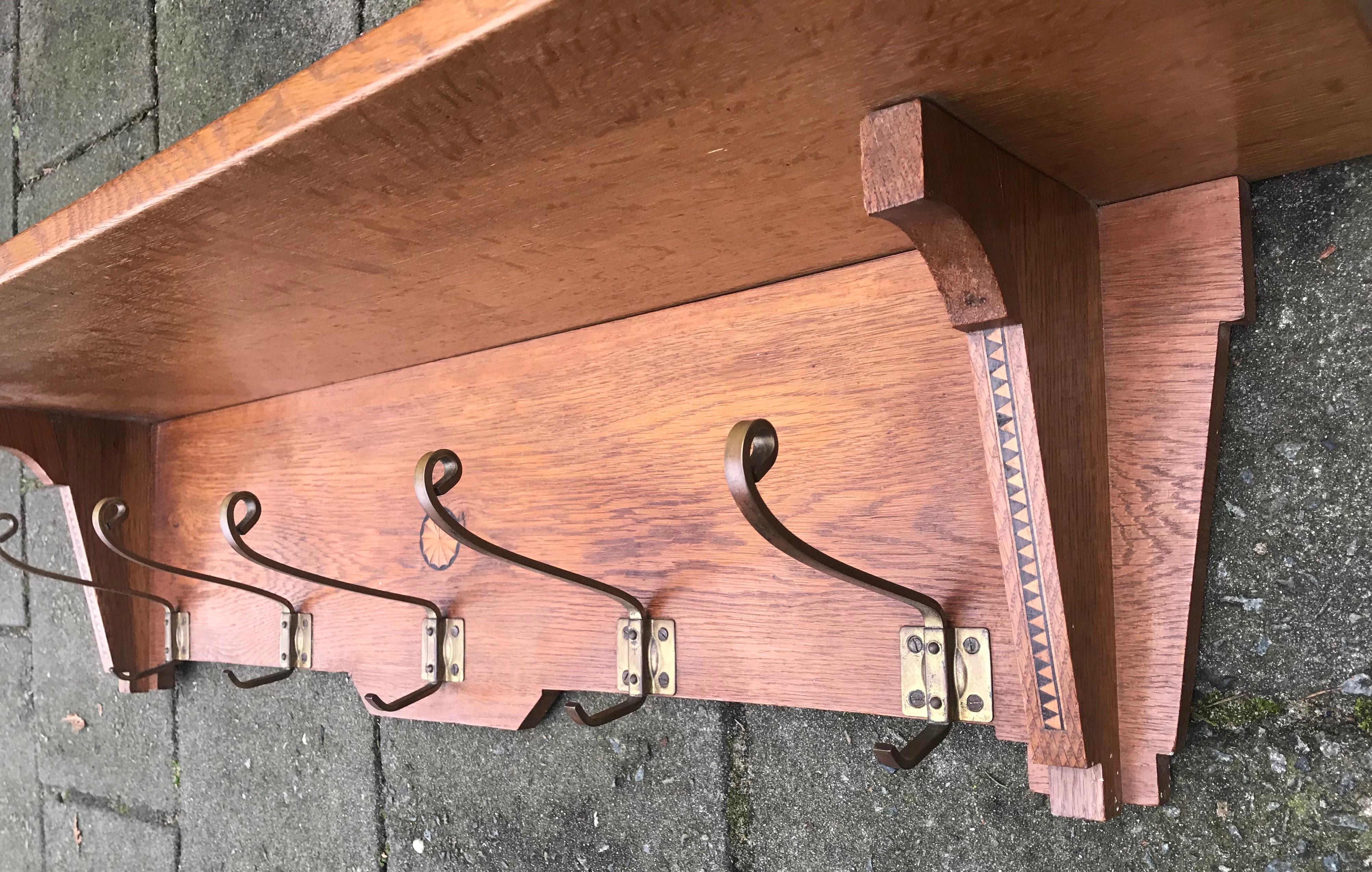 Practical size and light color antique coat rack.

If you are looking for a fine quality Arts & Crafts era coat rack then this handmade and great condition specimen for wall mounting could be perfect for your interior. The light color oak and sleek