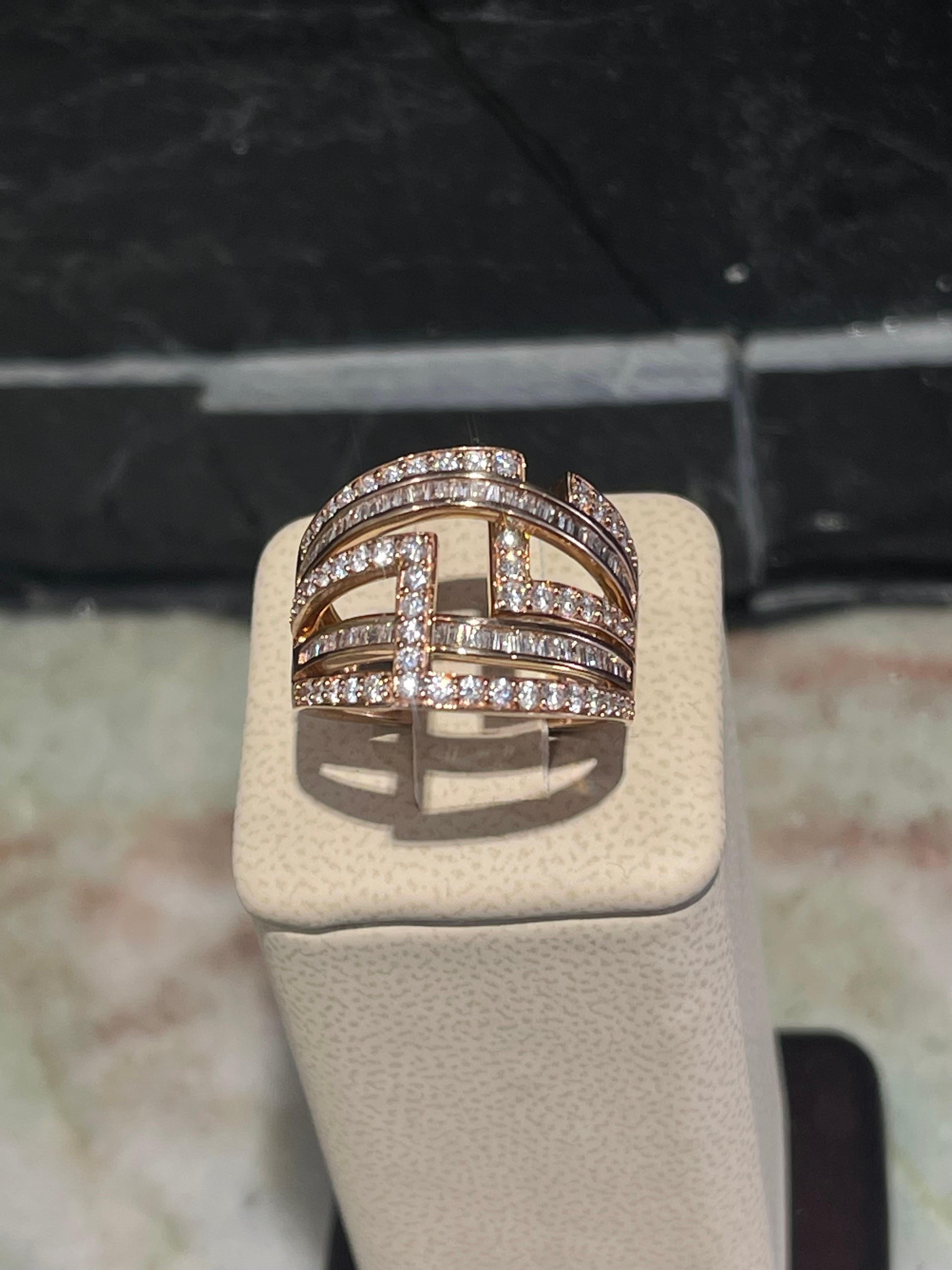 Stylish Diamond Ring In 14k Rose Gold .

Approximately 2 carats in clear round and baguette cut diamonds.

Size 7.