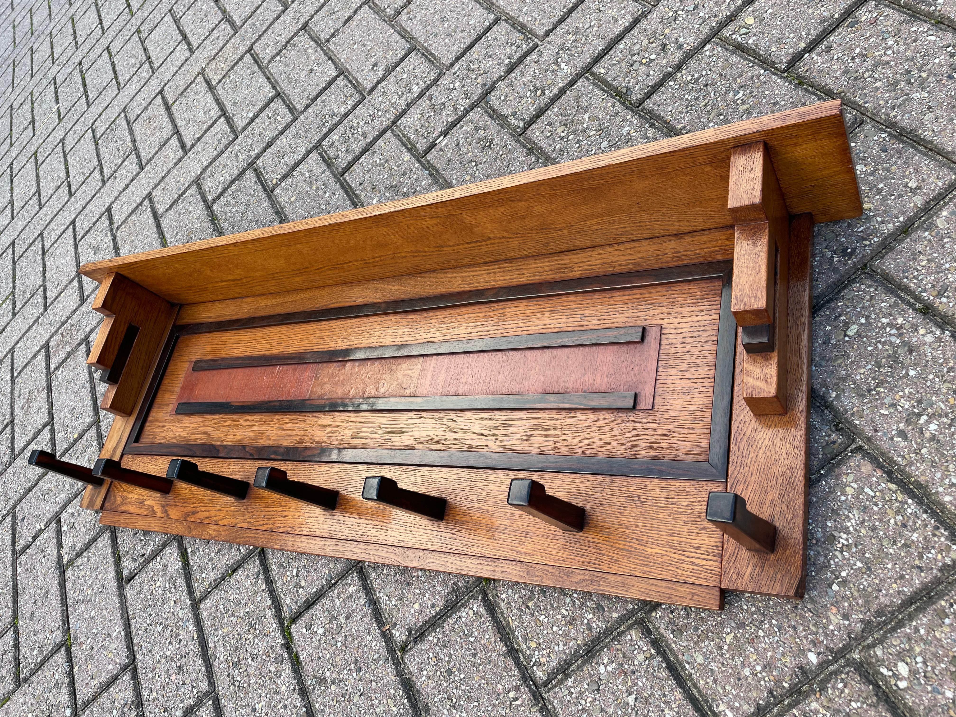 Rare, great looking and superb condition Dutch Art Deco coat rack

This geometrical coat rack from the Dutch Art Deco era was designed by Paul Izeren and executed in the studio of 'De Genneper Molen' in the Netherlands. This studio was named after