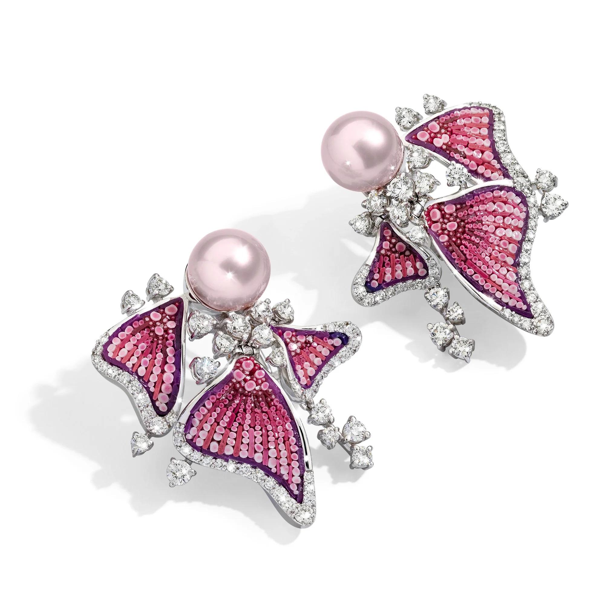 Inspired by the vibrancy of the ocean depths, the 18-carat white gold Anemone Blush earrings capture the agility of elegant fins in muted colours. 
An enchanting micromosaic in shades of pink enriches the composition, while brilliant-cut white