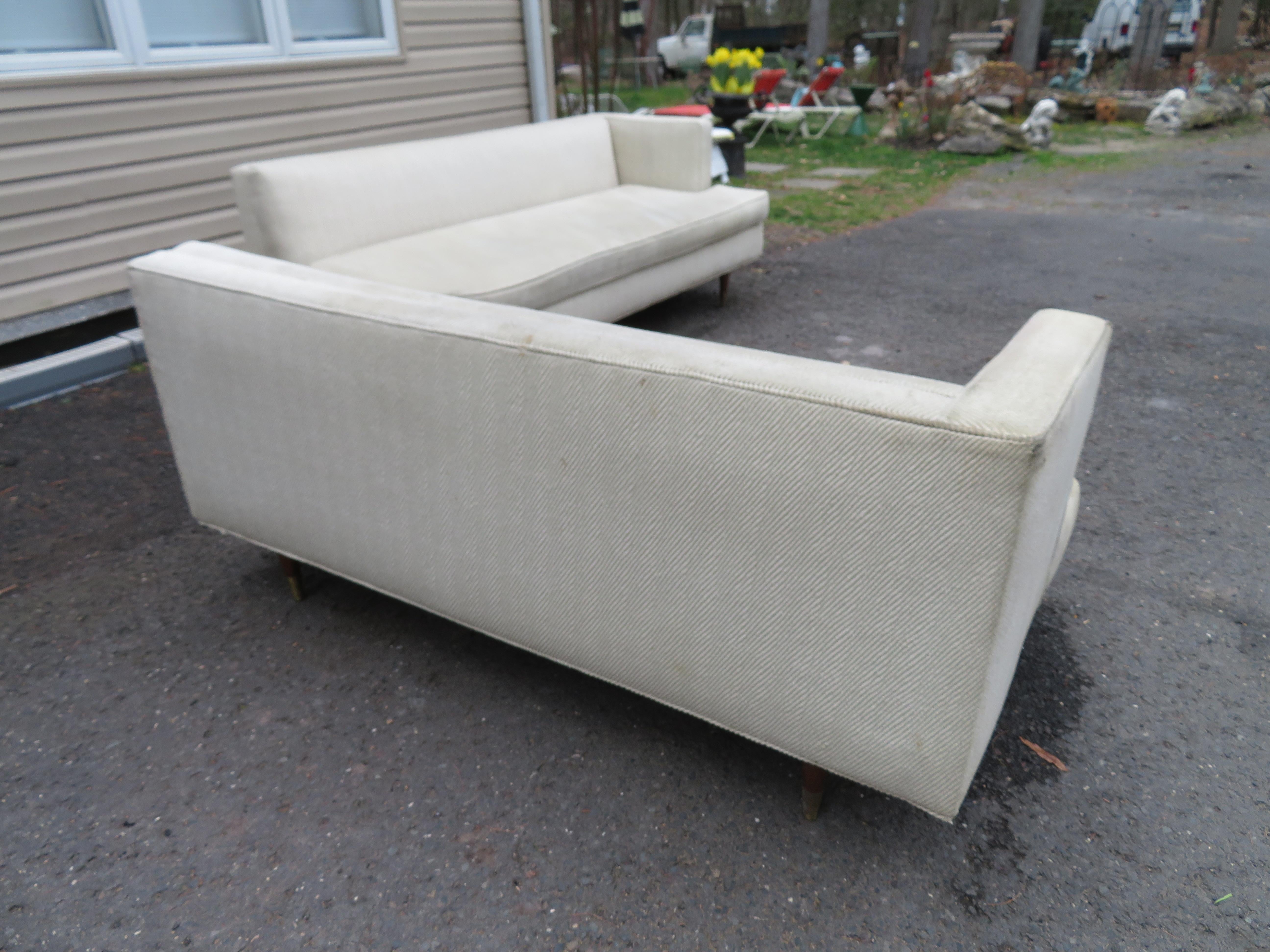 Stylish 2 piece Edward Wormley for Dunbar style sectional sofa. This one is going to need to be re-upholstered but oh the possibilities! We actually love the L-shaped setup and feel this would be great with a mid-century square table in the corner