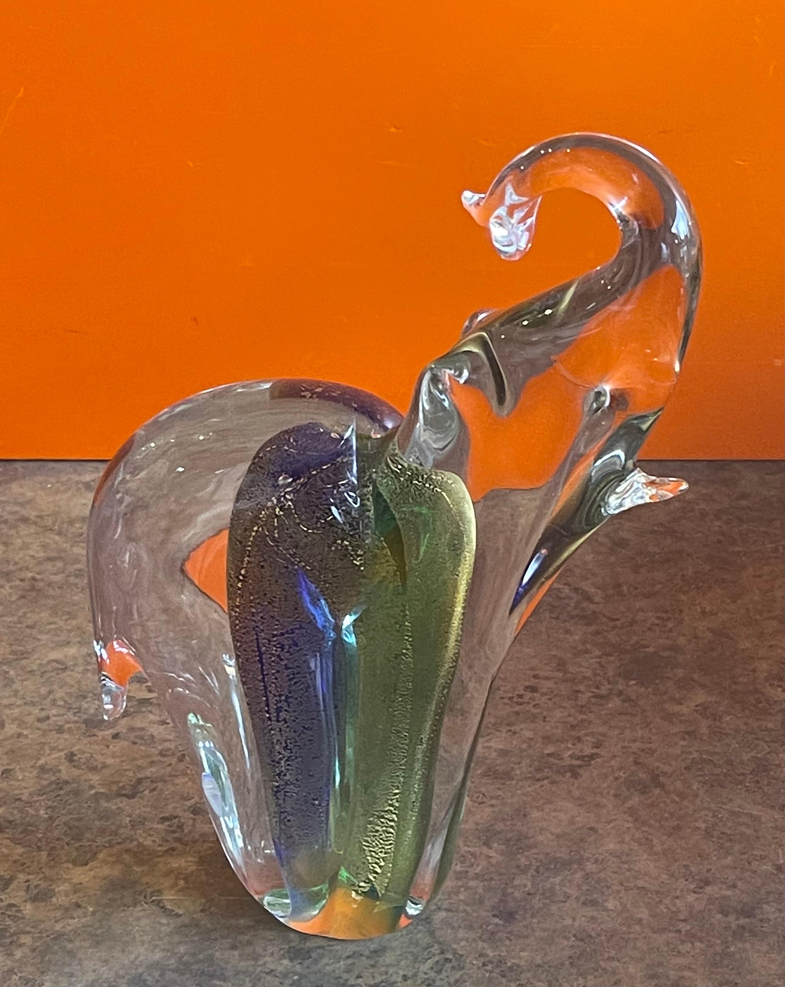 Stylish elephant sommerso art glass sculpture by Murano Glass, circa 1970s. The piece has a wonderful inner blue and green with gold fleck color on a clear glass body. The sculpture is in very good condition with no chips or cracks (some scratches