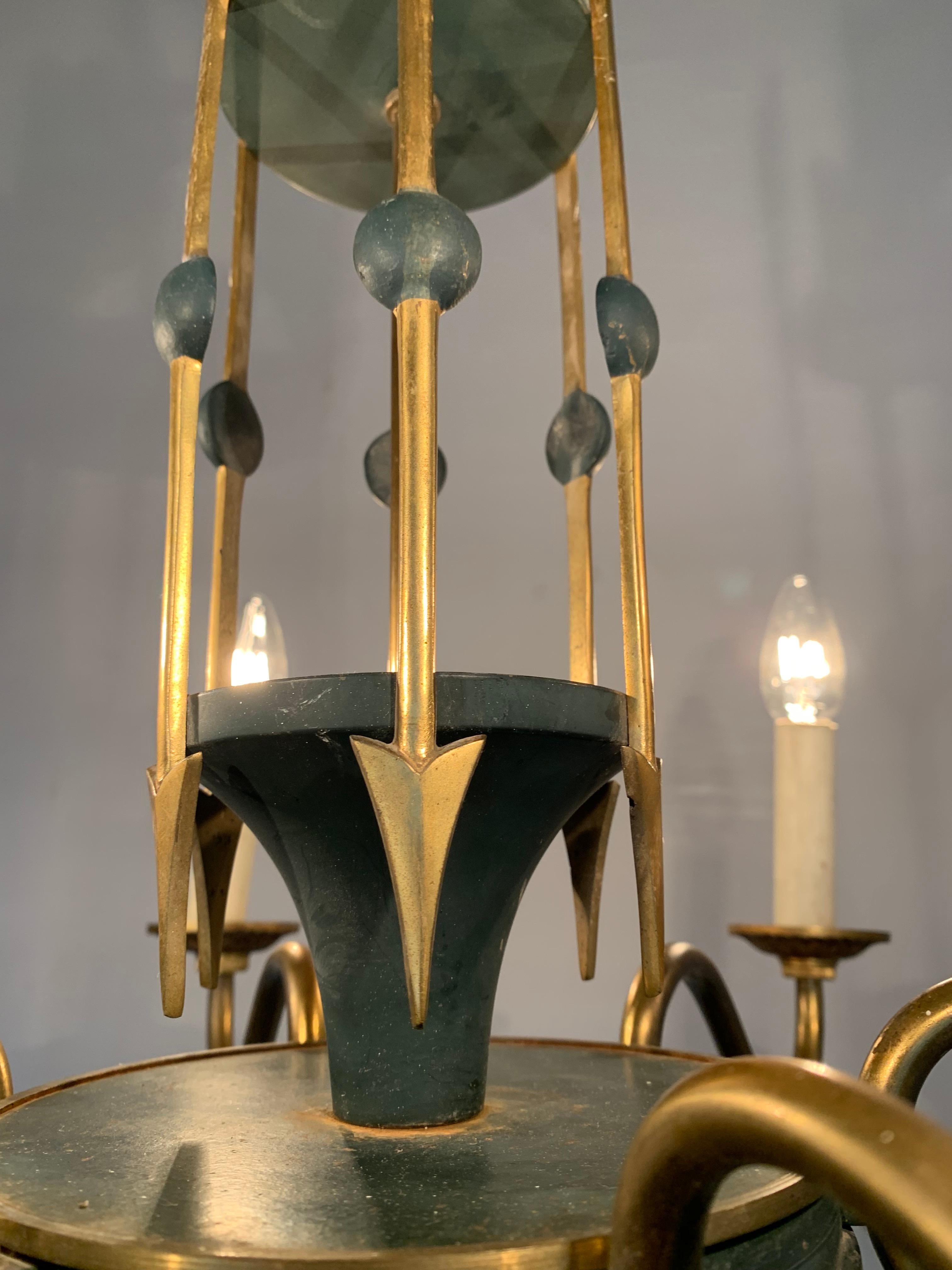 Stunning six-light pendant with gilt bronze arrows and swan head sculptures. 

This top quality made, early 1900s chandelier could be the perfect light fixture to grace your living space. Both on and off this quality antique with a deeper meaning