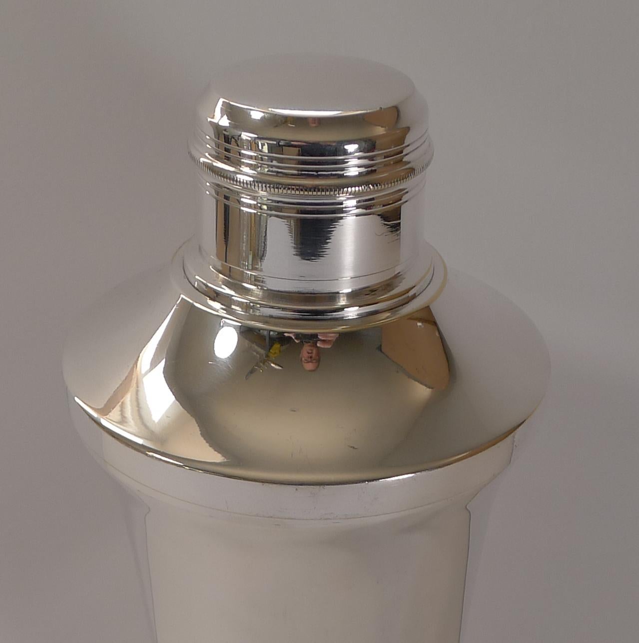 A very smart Art Deco cocktail shaker, French in origin and fully signed by the silversmith on the underside as per the photographs.

Just back from our silversmith's workshop where it has been professionally cleaned and polished, restoring it to