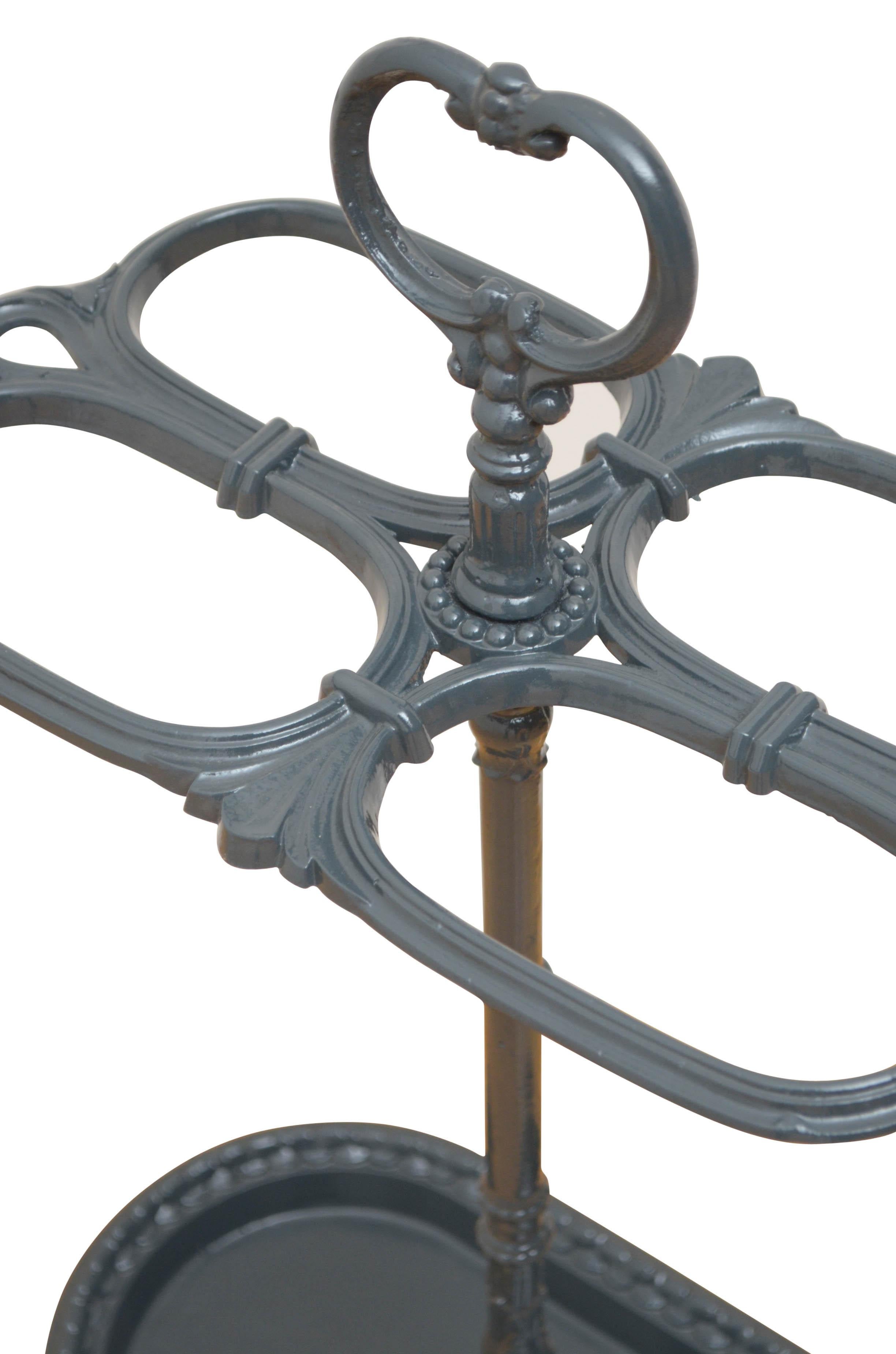K0360 Stylish 19th century grey umbrella or walking cane stand having a loop finial and four compartments on decorative column terminating in oval drip tray. This antique umbrella stands has been powdercoated in grey and is now ready to use at home,