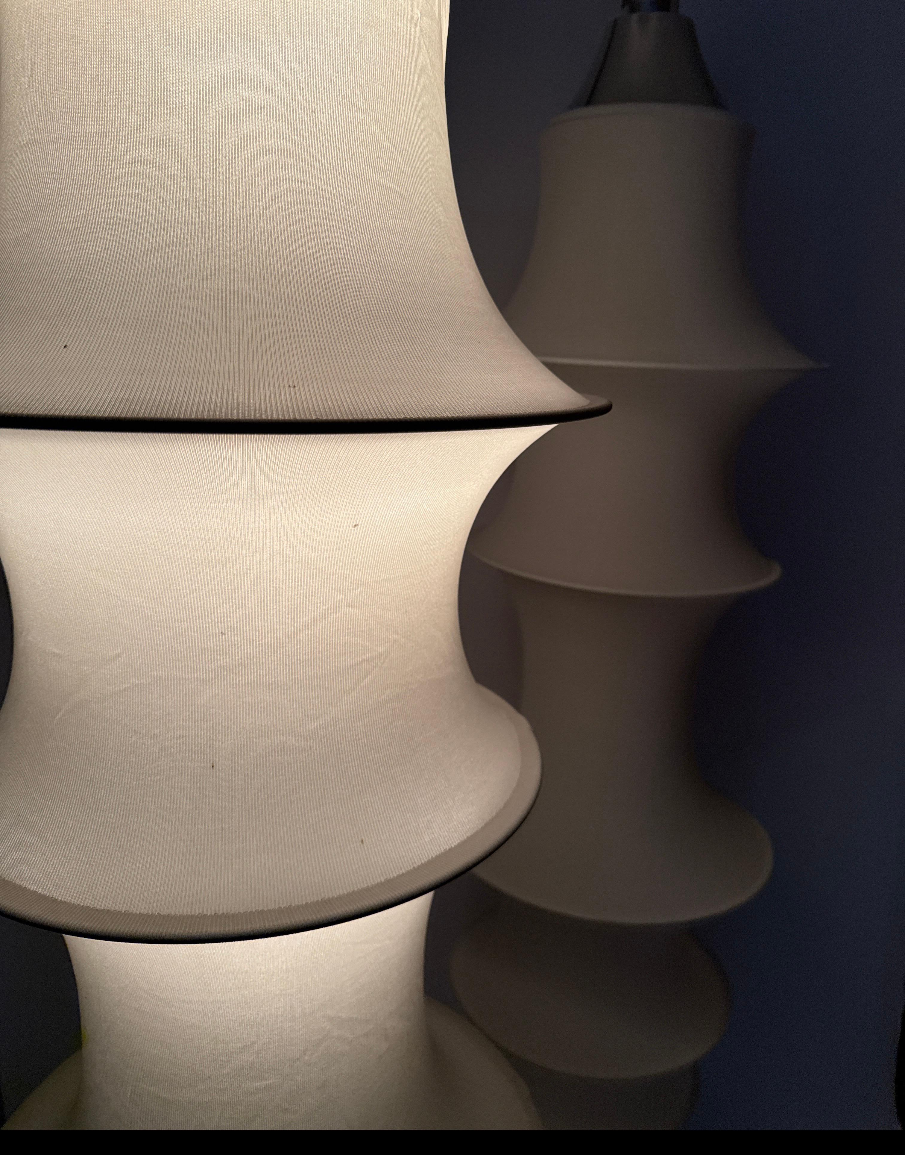 This pendan is a timeless classic lamp which is designed by Bruno Munari for Danese around the 1960s. This beautiful pendant is made up of 6 rings made out of high guality aluminium.In addition the lamp has an aluminium fitting and ceiling rose. 