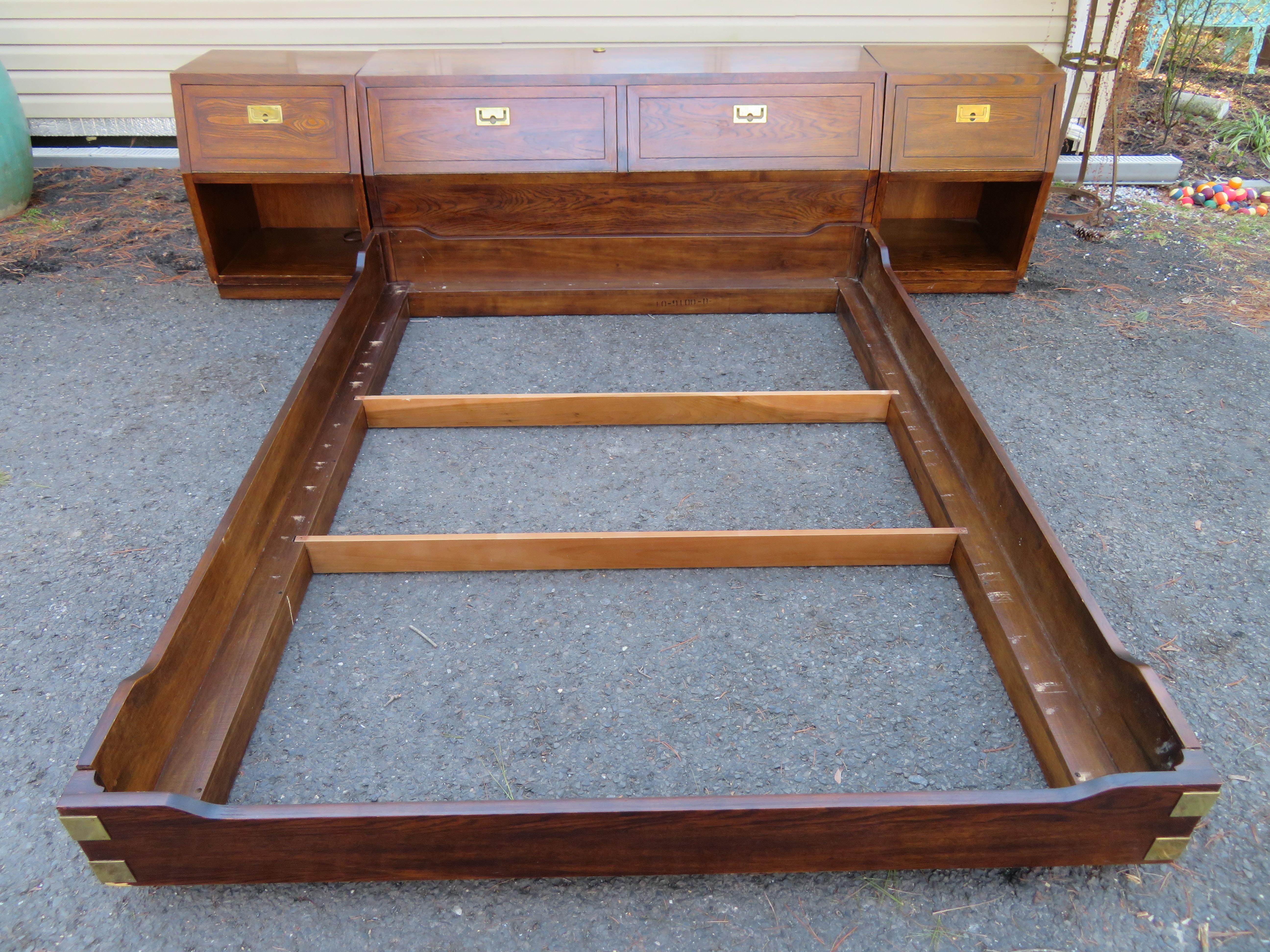 Highly sought after Henredon scene one queen size headboard/ platform bed with storage inside the headboard. This set includes the matching nightstands wired with electrical outlets in both stands and in the headboard. This set measures 27