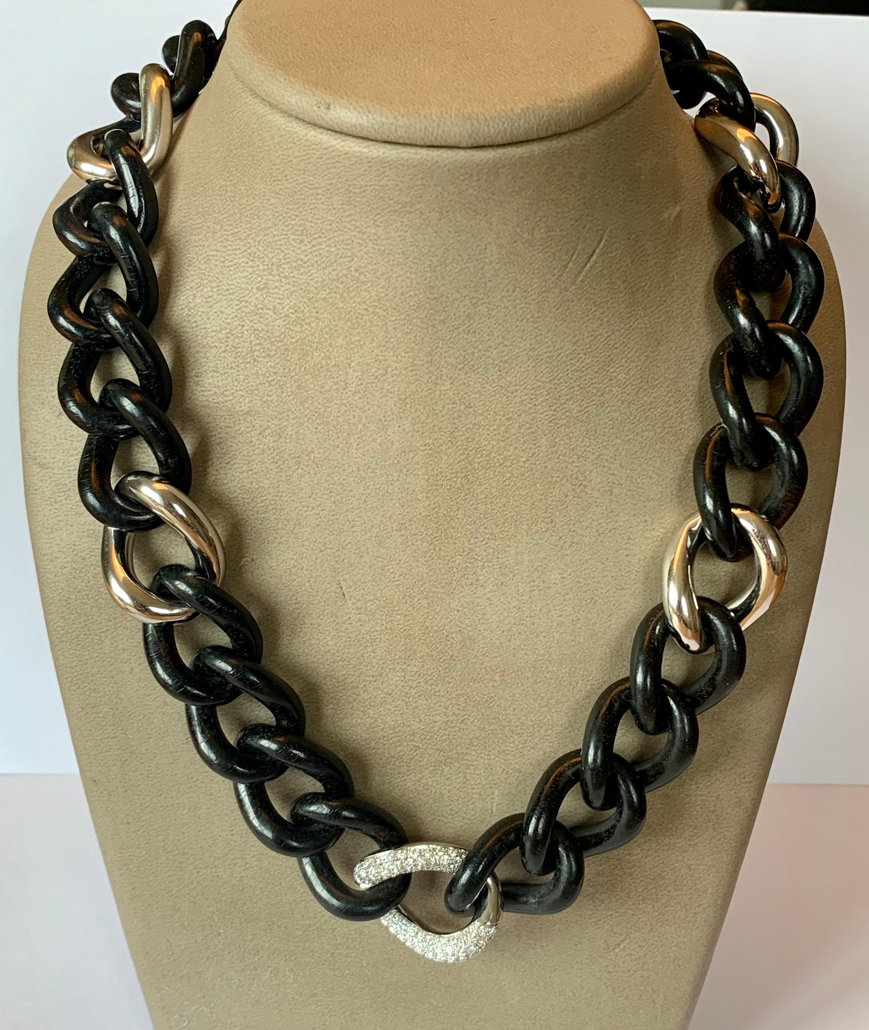 A Fine Italian 18 K white Gold and Ebony Groumette Chain Necklace, of which one link is highlighted with brilliant cut Diamonds weighing 1.62 ct.
 Nature and metal come together in this necklace where the brilliance of classic Groumette gold is