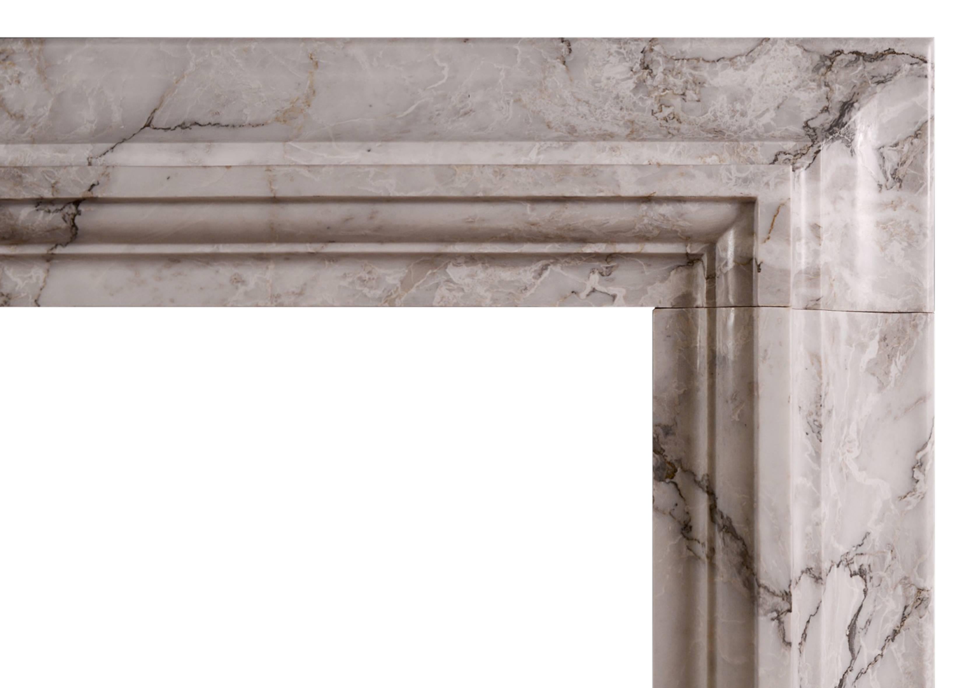 A stylish Italian fireplace in Italian Arabescato marble. Moulded frieze and jambs of architectural form. A copy of an original chimneypiece.

N.B. May be subject to an extended lead time.

Measures:
Shelf width:           15720 mm /   61 3/4