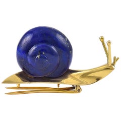 Vintage Stylish Lapis Lazuli and 18 Karat Gold Snail Brooch by Hermes, Paris